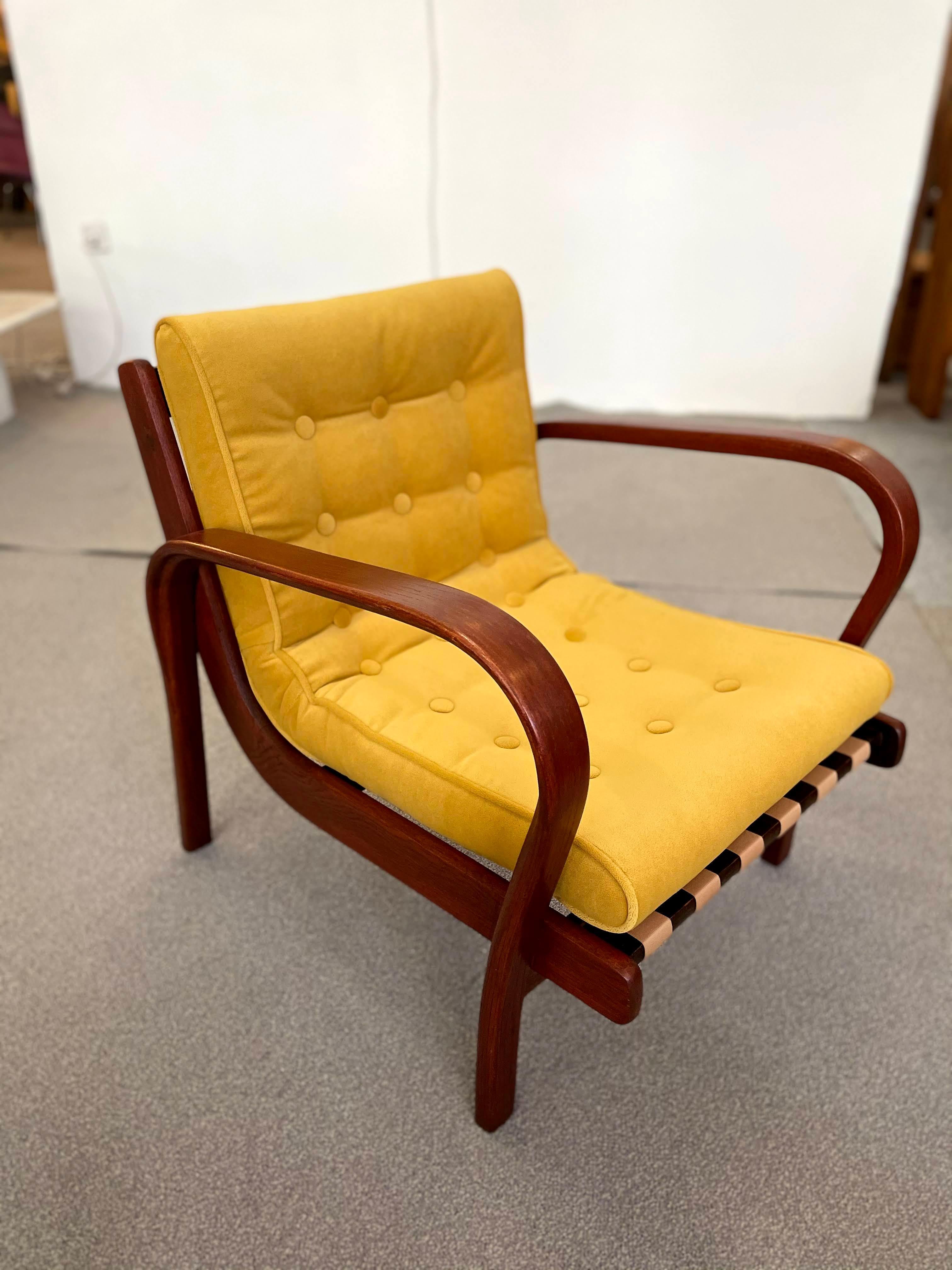 This stylish Mid-Century Modern Czech lounge armchair designed by Kozelka and Kropacek and manufactured by Interior Praha.
 Received a silver medal in the 1946 Milan Triennale.

We've refinished the woodwork and the cushions have been