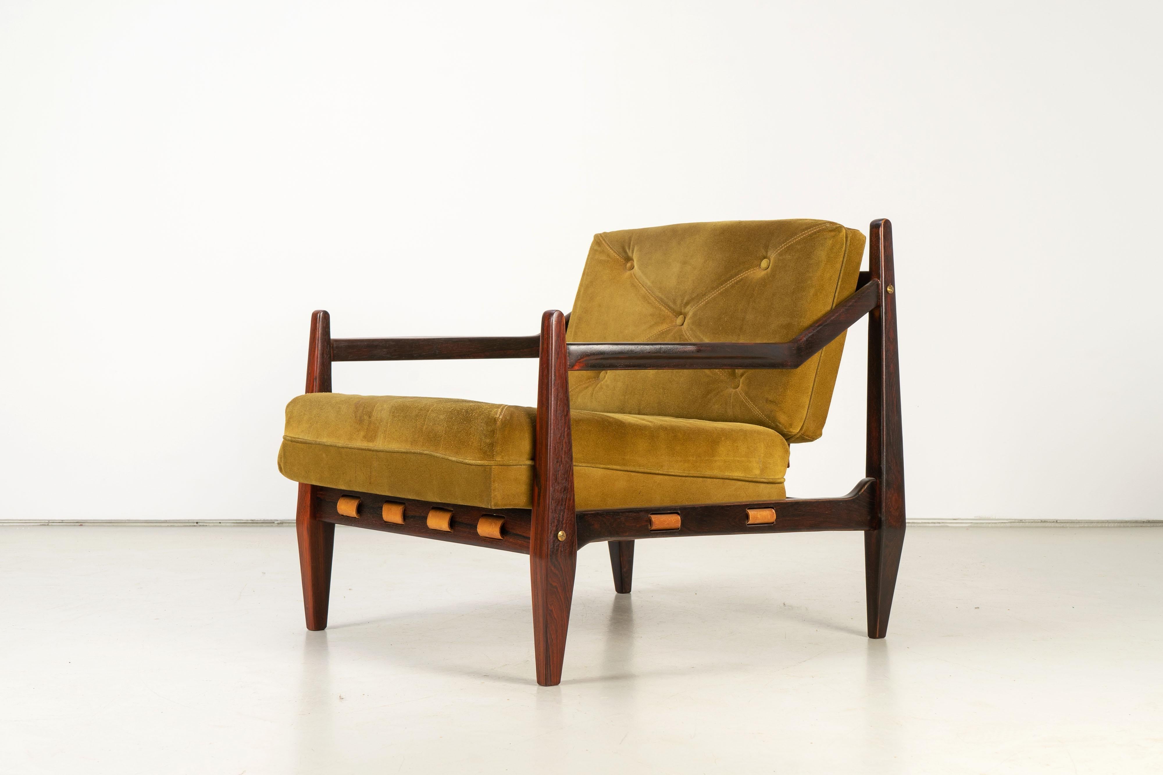 Rare rosewood armchair with ottoman by Jean Gillon from the 1960s. Ottoman and armchair has been refinished but has original suede cushions. The buyer receives the CITES permit with the purchase (see pictures). 

Measures: Chair - 75 x 75 x 75/38