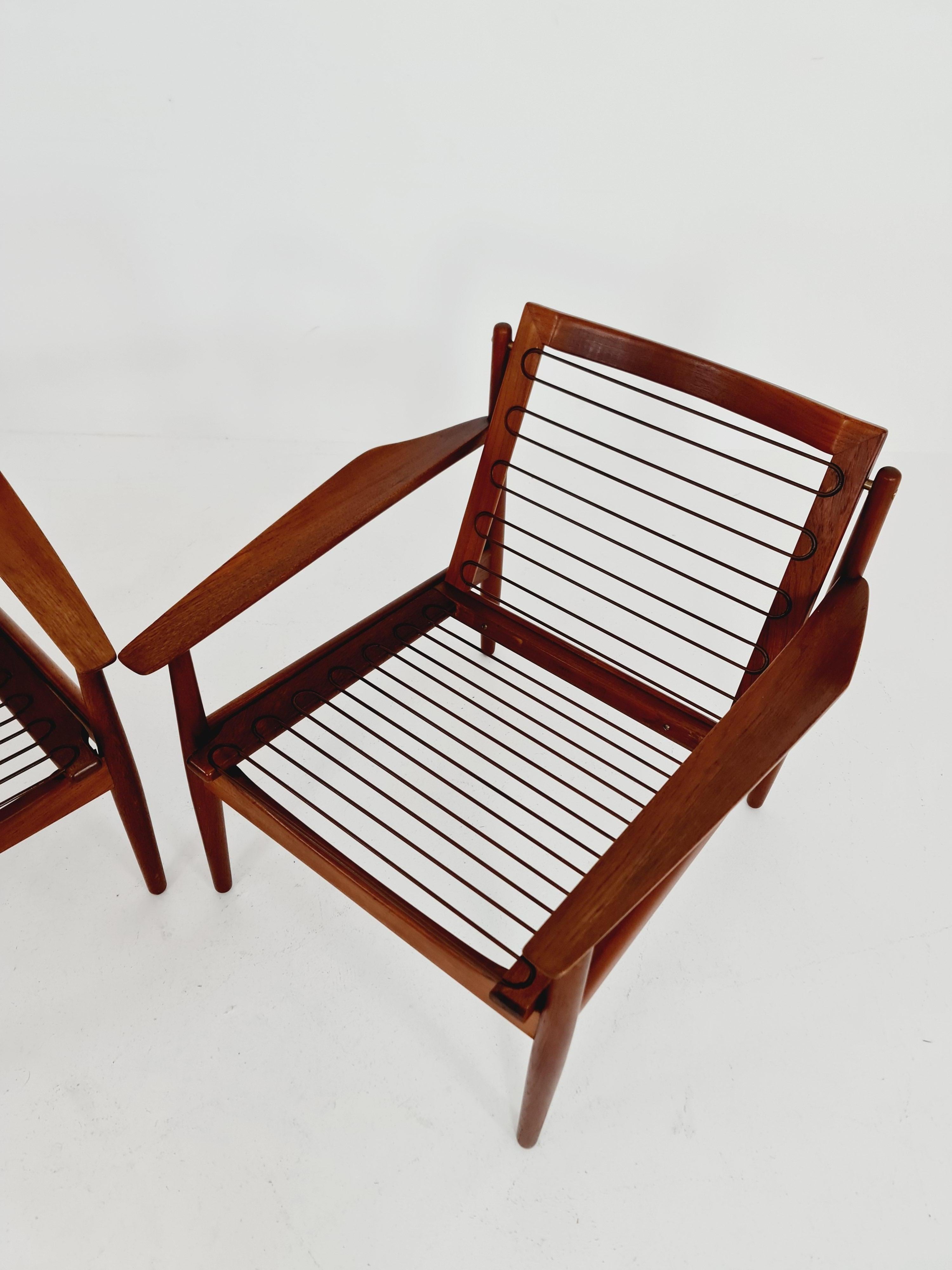 Mid century easy lounge chairs by Grete Jalk, Denmark, teak & brass, Set of 2 For Sale 4