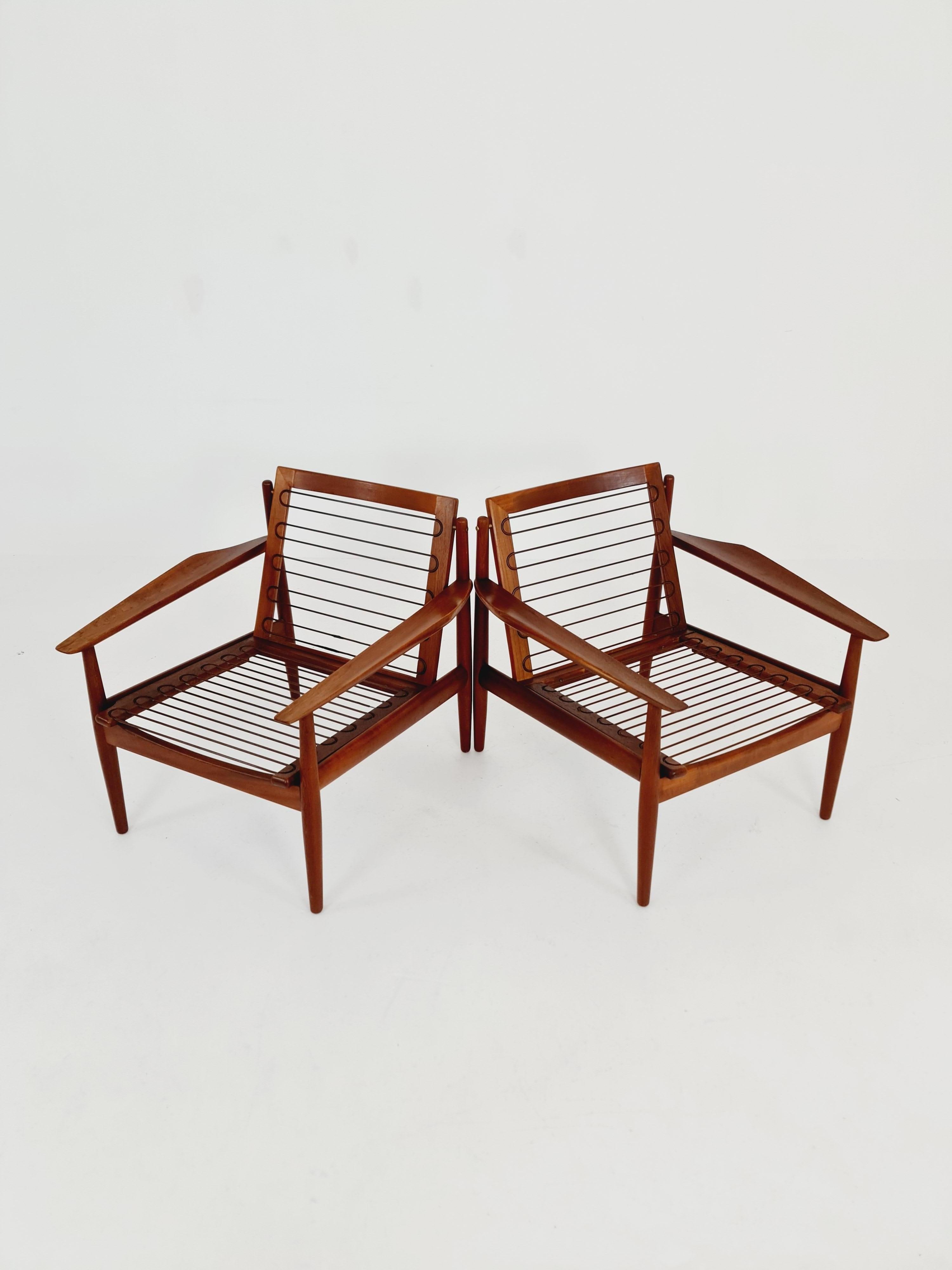 Mid century easy lounge chairs by Grete Jalk, Denmark, teak & brass, Set of 2 For Sale 7