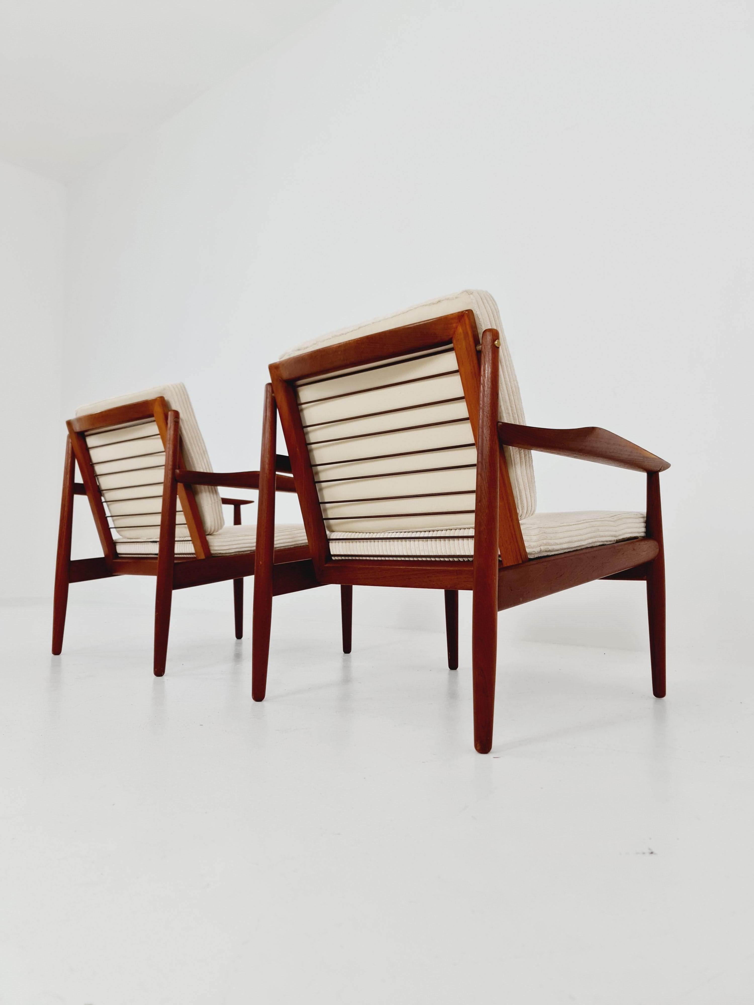 Mid-Century Modern Mid century easy lounge chairs by Grete Jalk, Denmark, teak & brass, Set of 2 For Sale