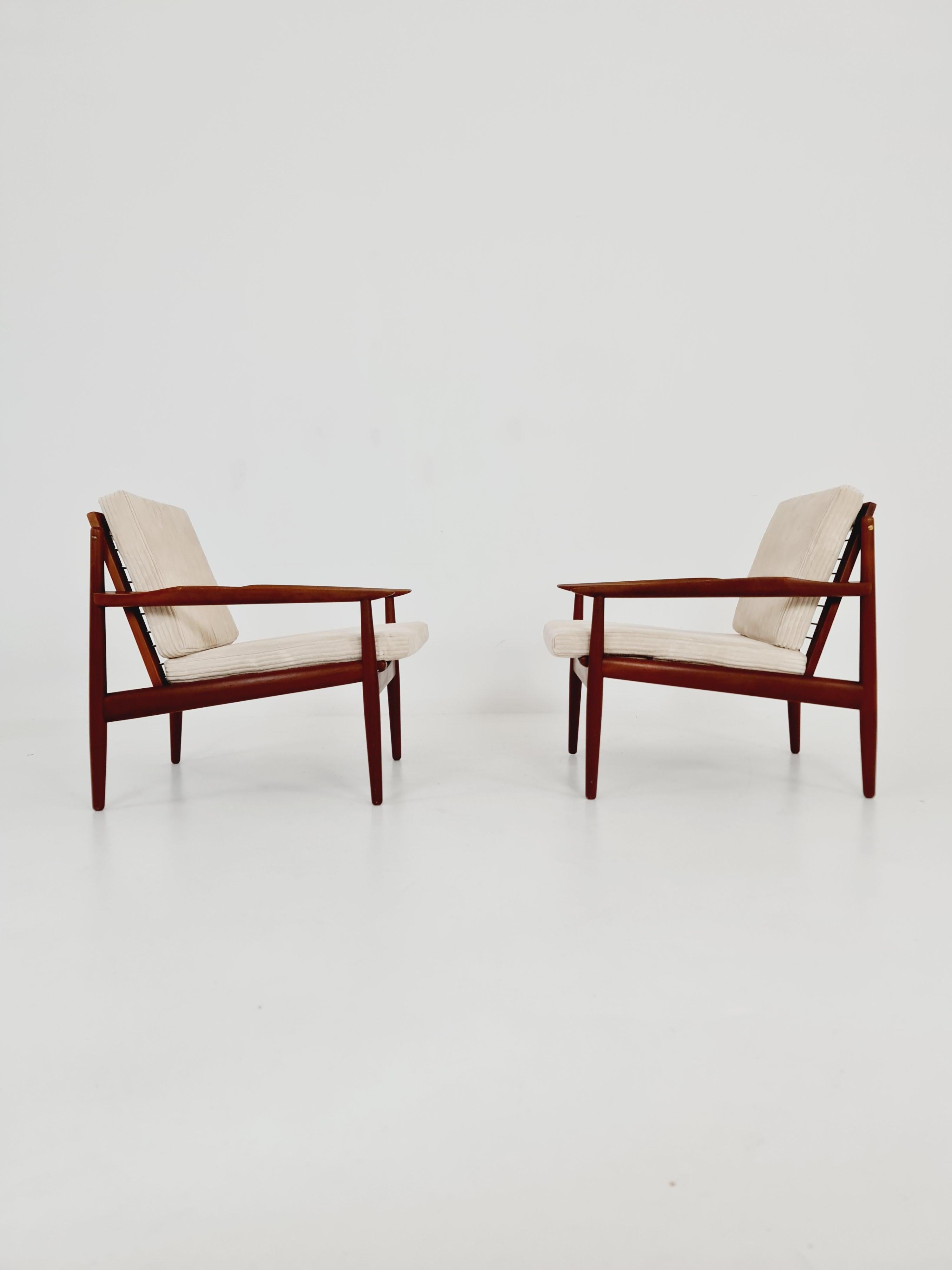 Mid century easy lounge chairs by Grete Jalk, Denmark, teak & brass, Set of 2 For Sale 1