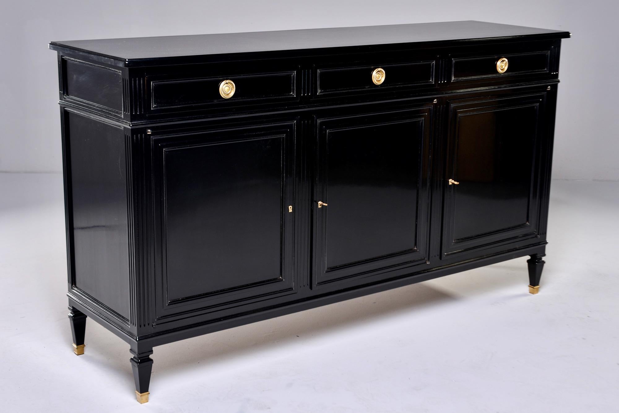 English Mid Century Ebonized Commode or Buffet with Three Drawers and Three Doors