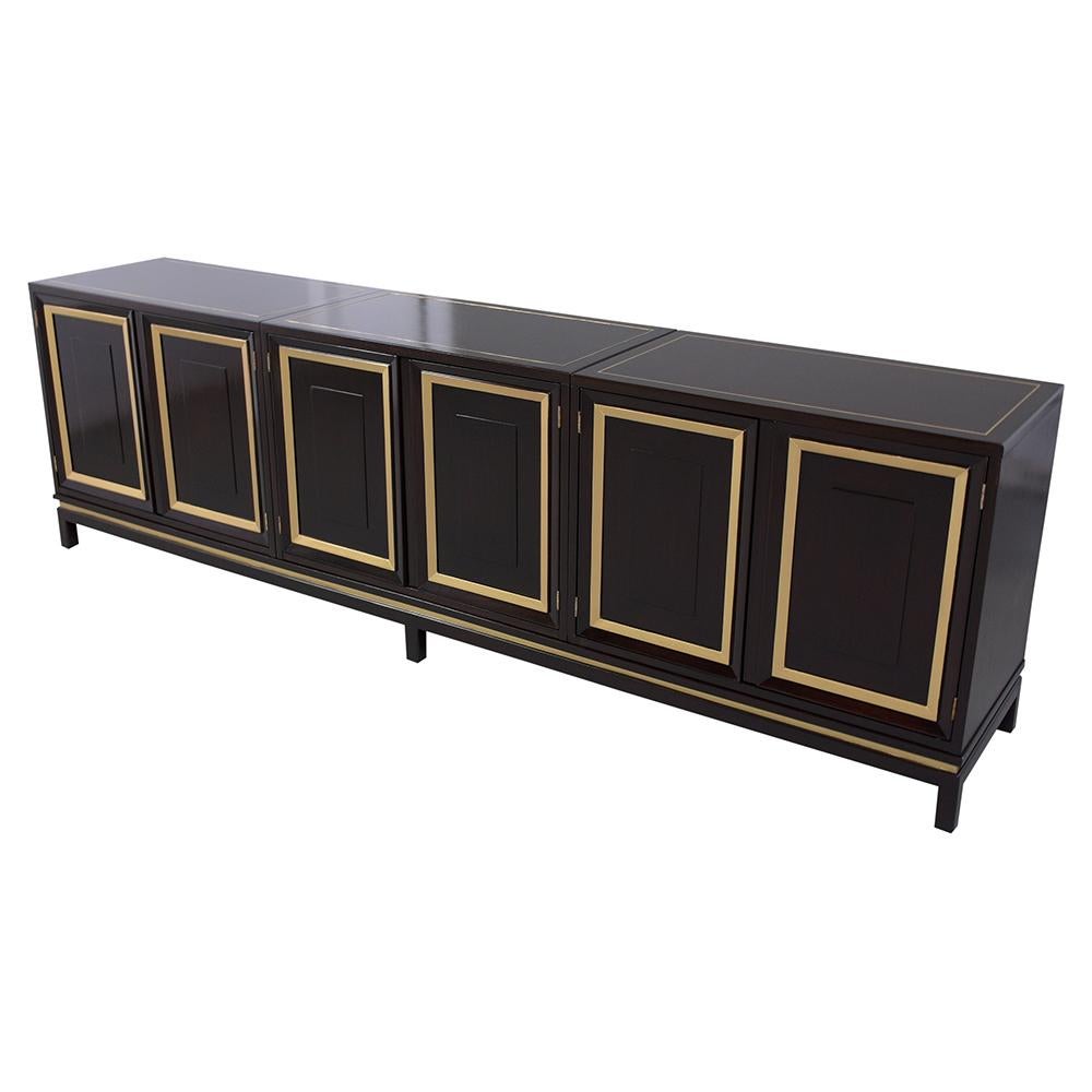 This vintage mid-century three-piece ebonized credenza is in great condition and has been professionally restored. This buffet has been newly stained in a rich ebonized color with gilt details and has been sealed with a clear lacquered finish. The