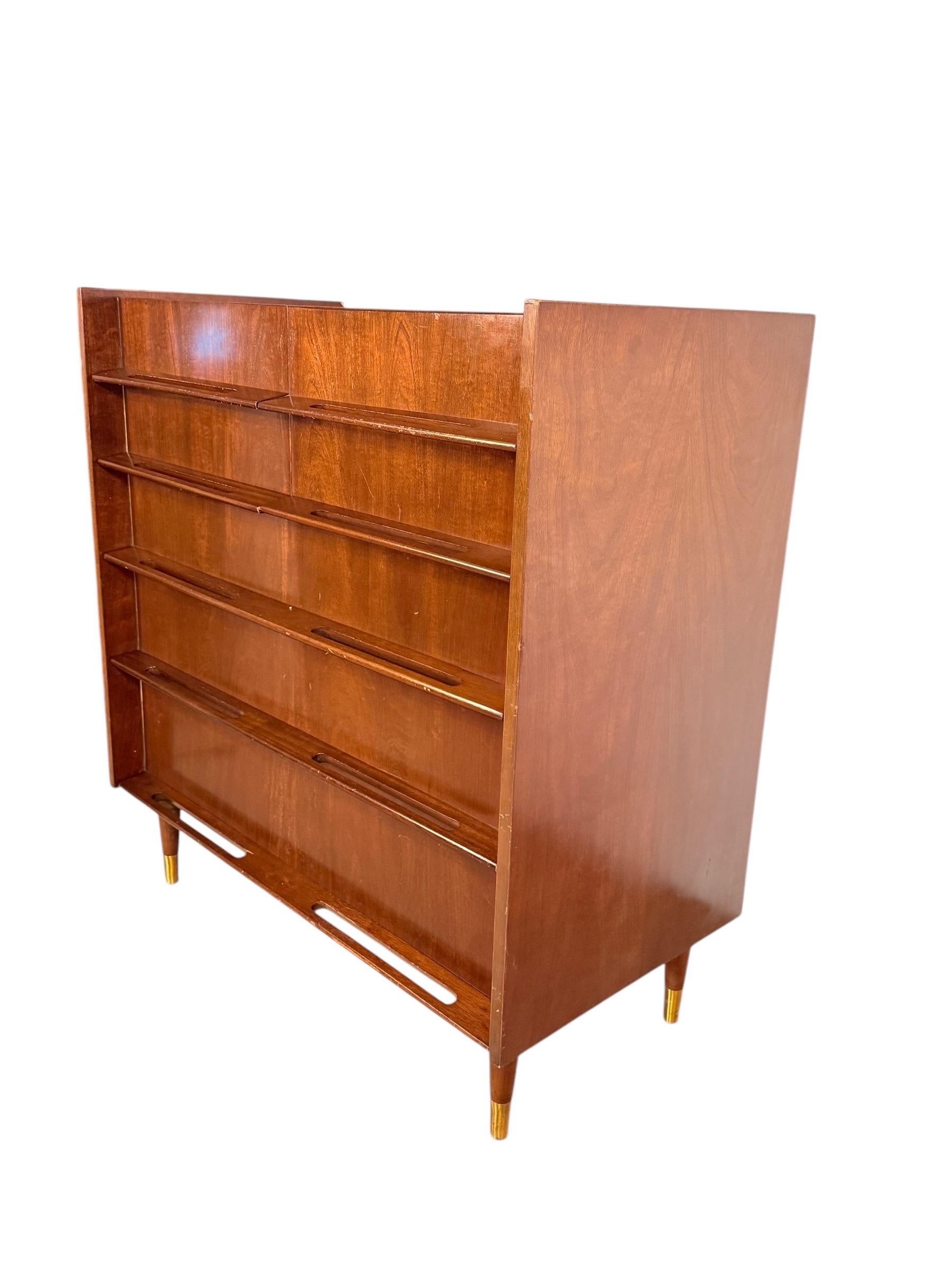 Edmond J. Spence Mid-Century Modern Walnut Dresser

This beautifully crafted walnut dresser by Edmond J Spence showcases his signature Scandinavian-inspired design, blending elegance and functionality. Featuring seven drawers—three full-width and