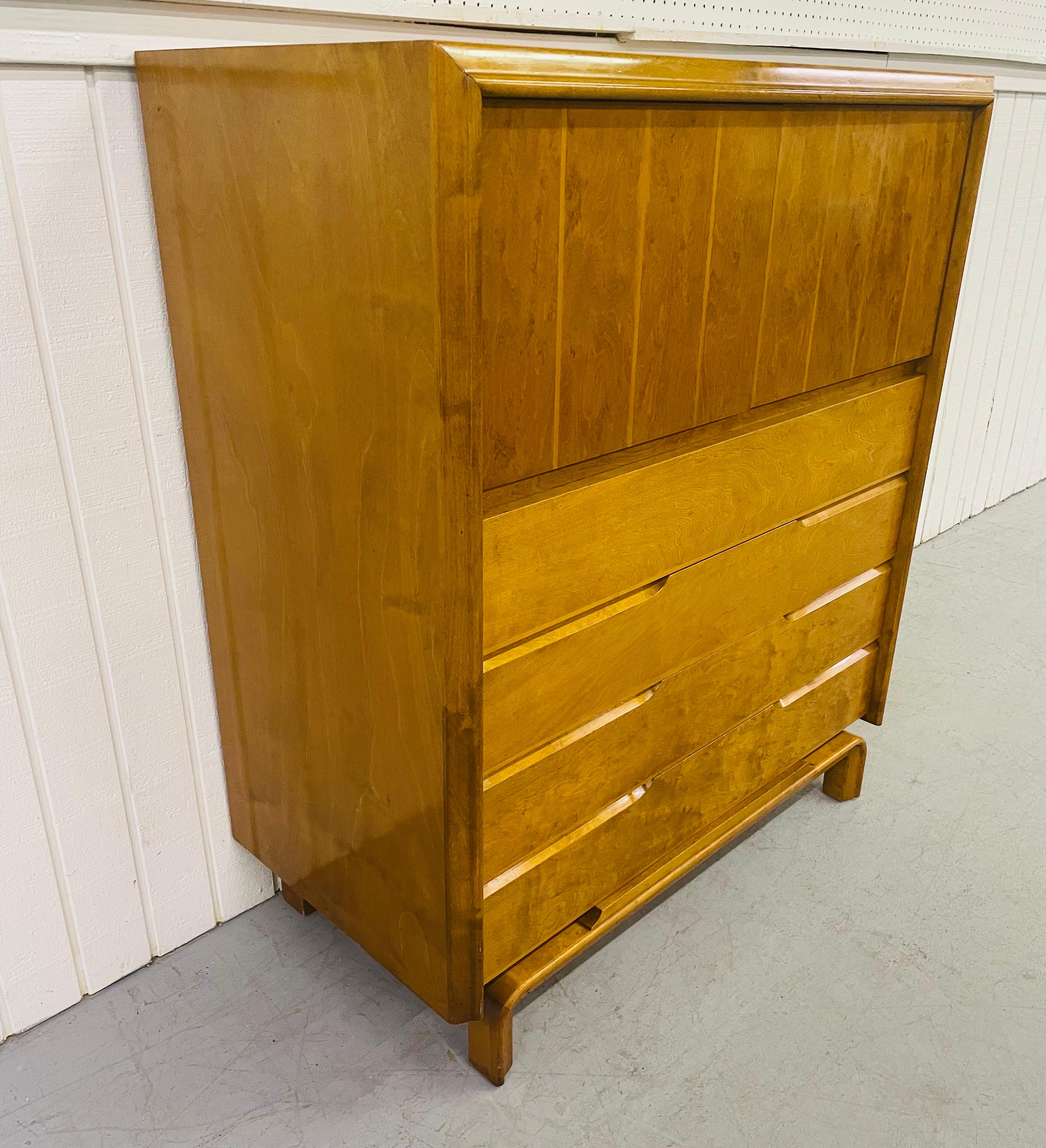 This listing is for a mid-century Edmond Spence high chest. Featuring two doors that open up to storage space, four drawers, and a beautiful champagne blonde finish.