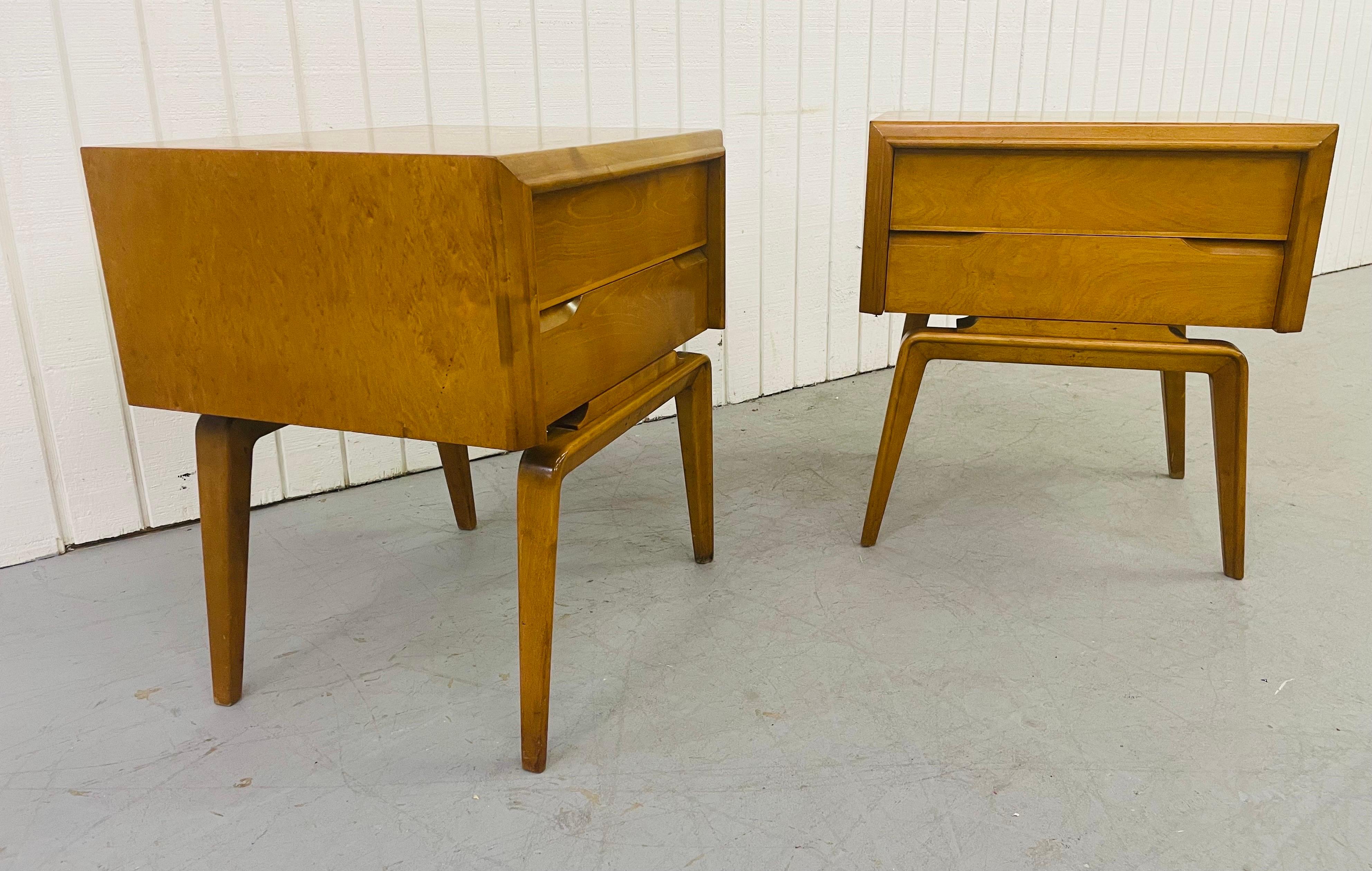 This listing is for a pair of mid-century Edmond Spence nightstands. Featuring exceptional tall legs, two drawers for storage, and a beautiful champagne blonde finish.