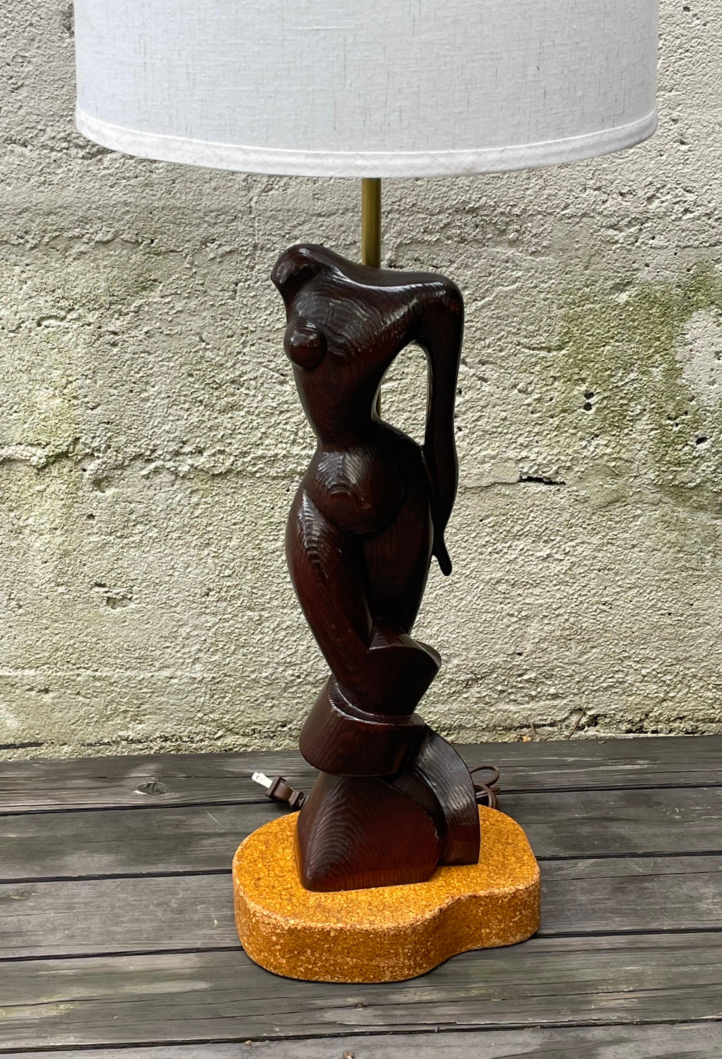 Fantastic carved wood female sculpture table lamp by Edward Stasack mounted on cork lined base. Rewired, shade not included. 26