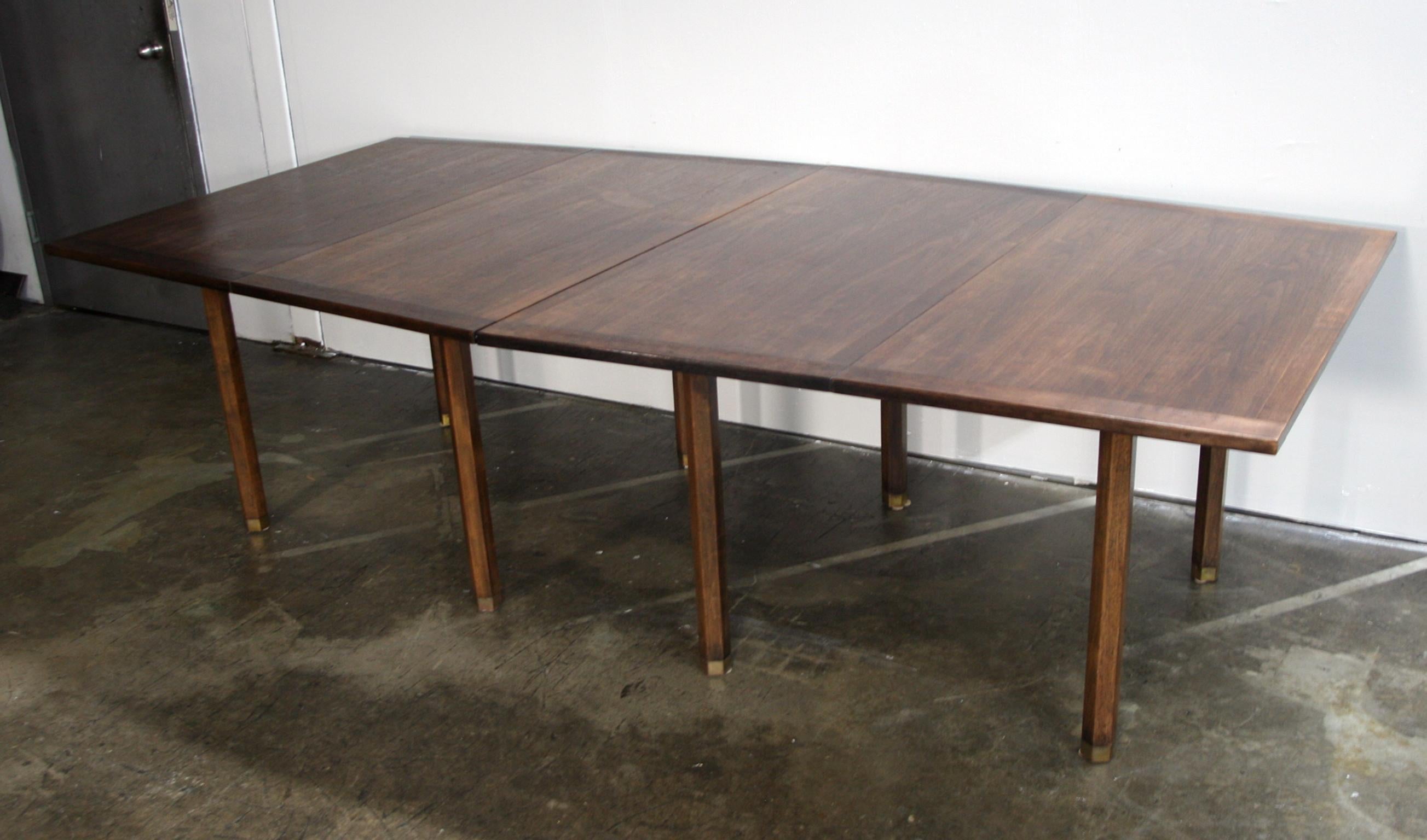 Midcentury Dunbar conference dining table walnut 8’ long. This is a rare custom ordered beautiful hexagonal Dunbar conference dining table by Edward Wormley circa 1960 with 8 solid walnut hexagon legs and brass caps. All solid walnut - newly