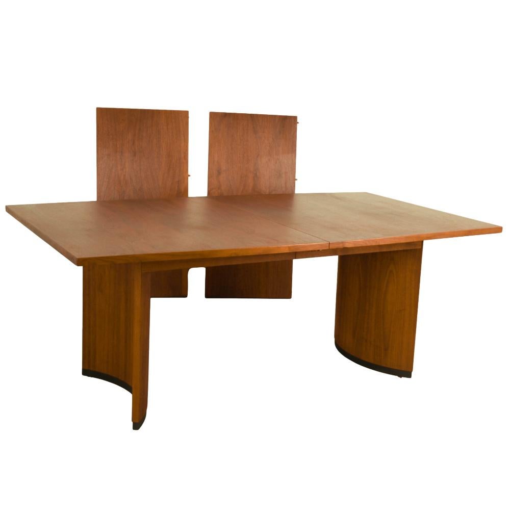 Beautiful, Mid-Century Modern Edward Wormley Style expandable dining table, by Lane Furniture 1970's. Featuring richly grained, gleaming walnut and smooth, clean lines characteristic of classic Danish design. This gorgeous walnut extending dining