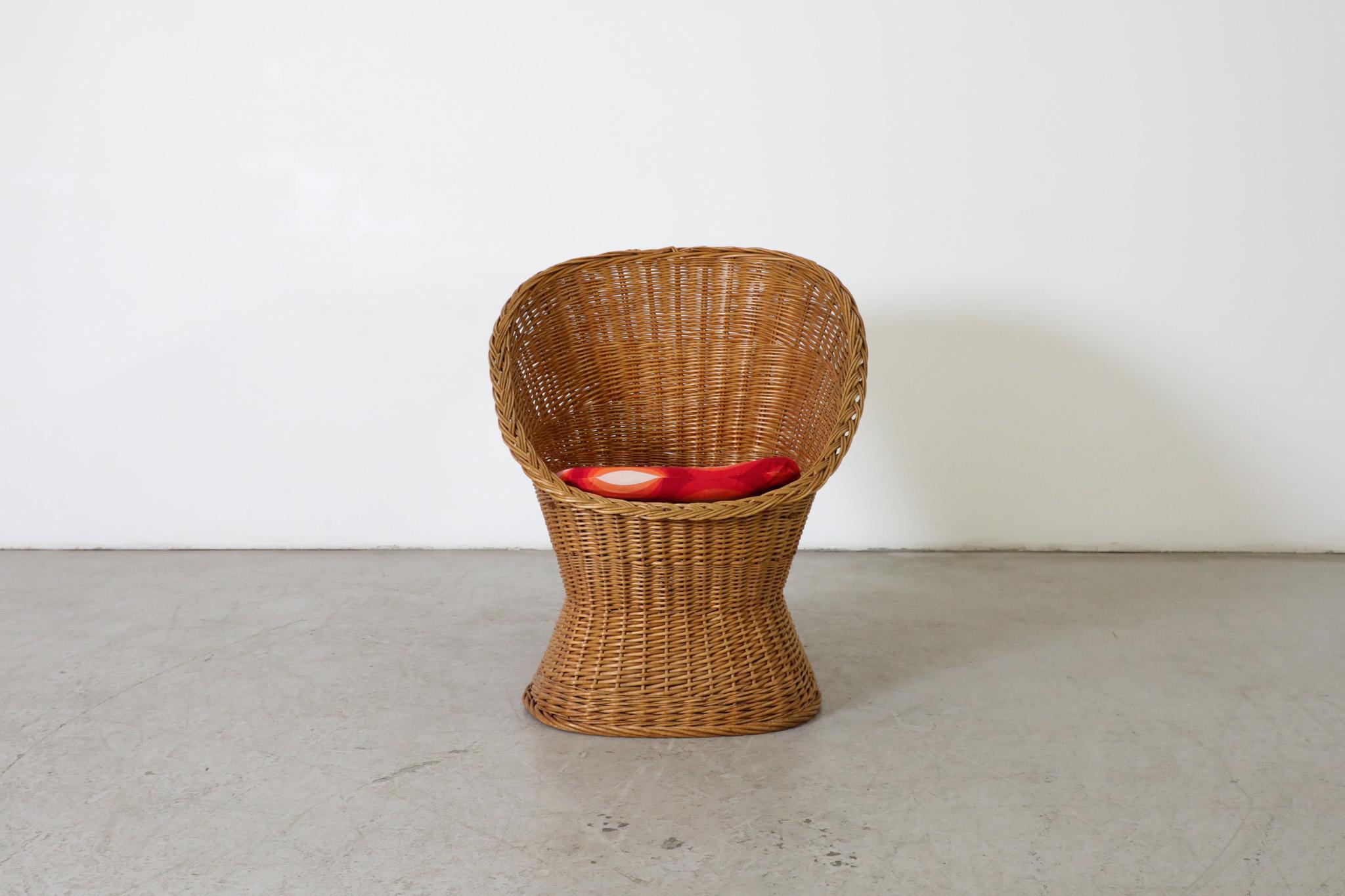 Mid-Century, hand woven rattan “Peacock” style lounge chair. in original condition with some wear appropriate for its age and use. Suitable for outdoor use with proper care and maintenance under dry, protected, covered area and covered or stored