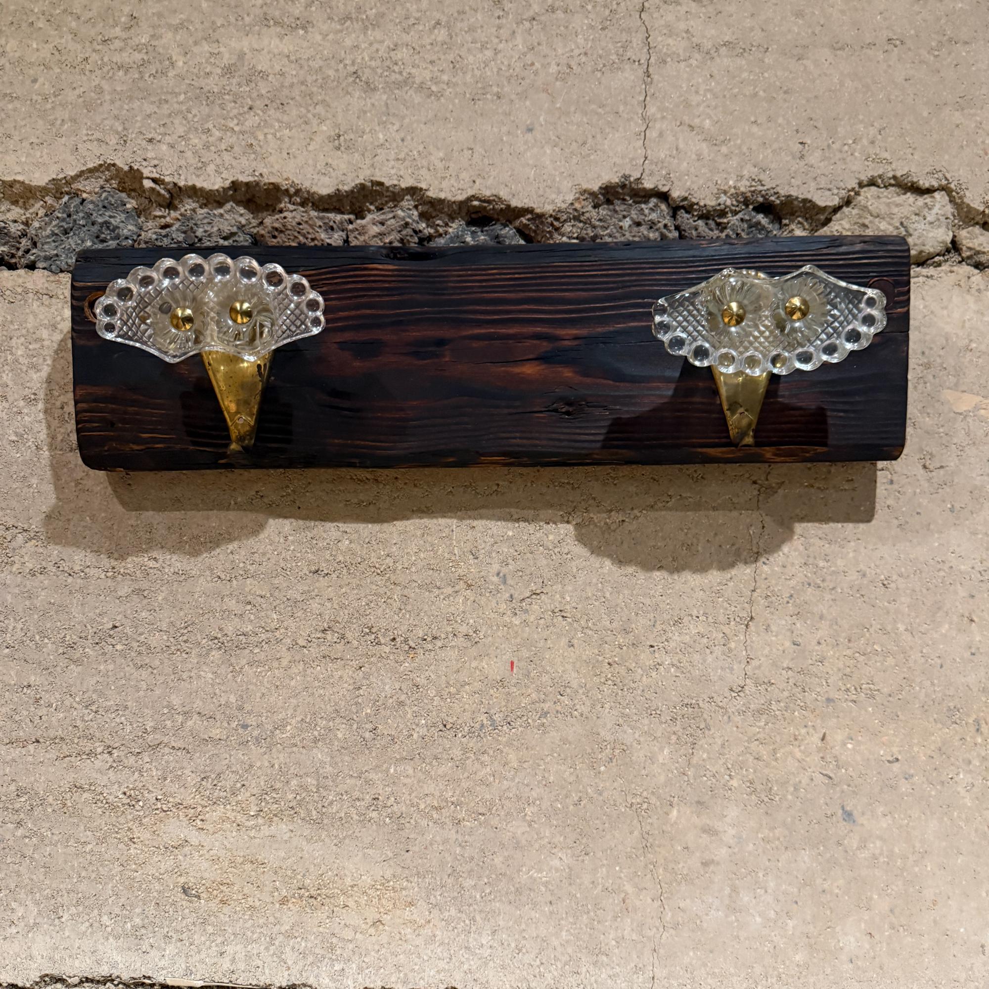 For your consideration, a pair of elegant Italian art glass and brass coat hat rack hooks set of two. Style of Fontana Arte, unmarked. Italy circa the late 1940s. Hooks mounted in a distressed wood, which can be used, or the hooks can be removed and