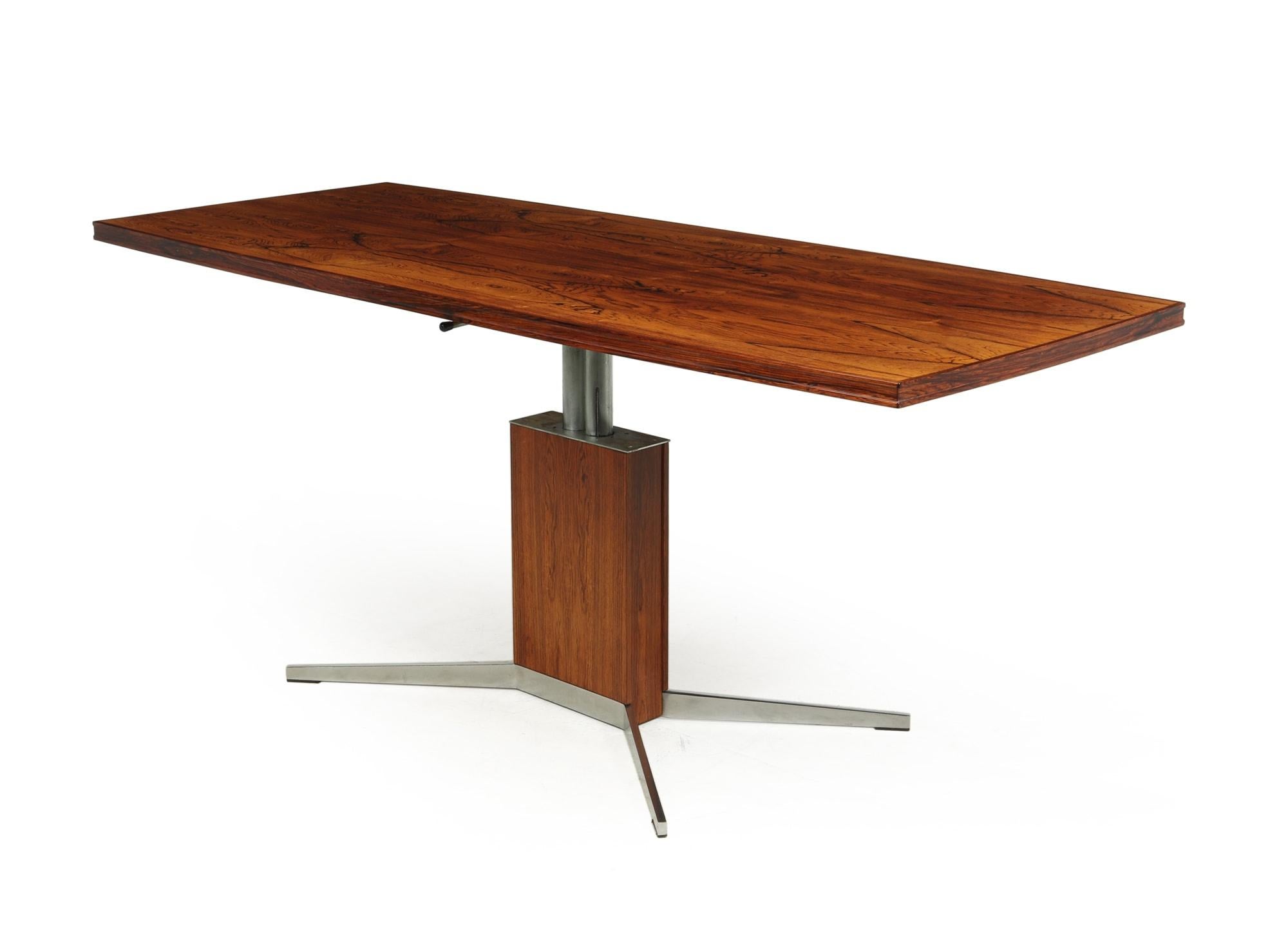A Mid-Century Modern mechanical rise and fall elevator coffee table, produced in France in the 1960’s with rosewood top and aluminium legs. There is a lever under the top for a break so can be stopped at any height between coffee and dining, the we