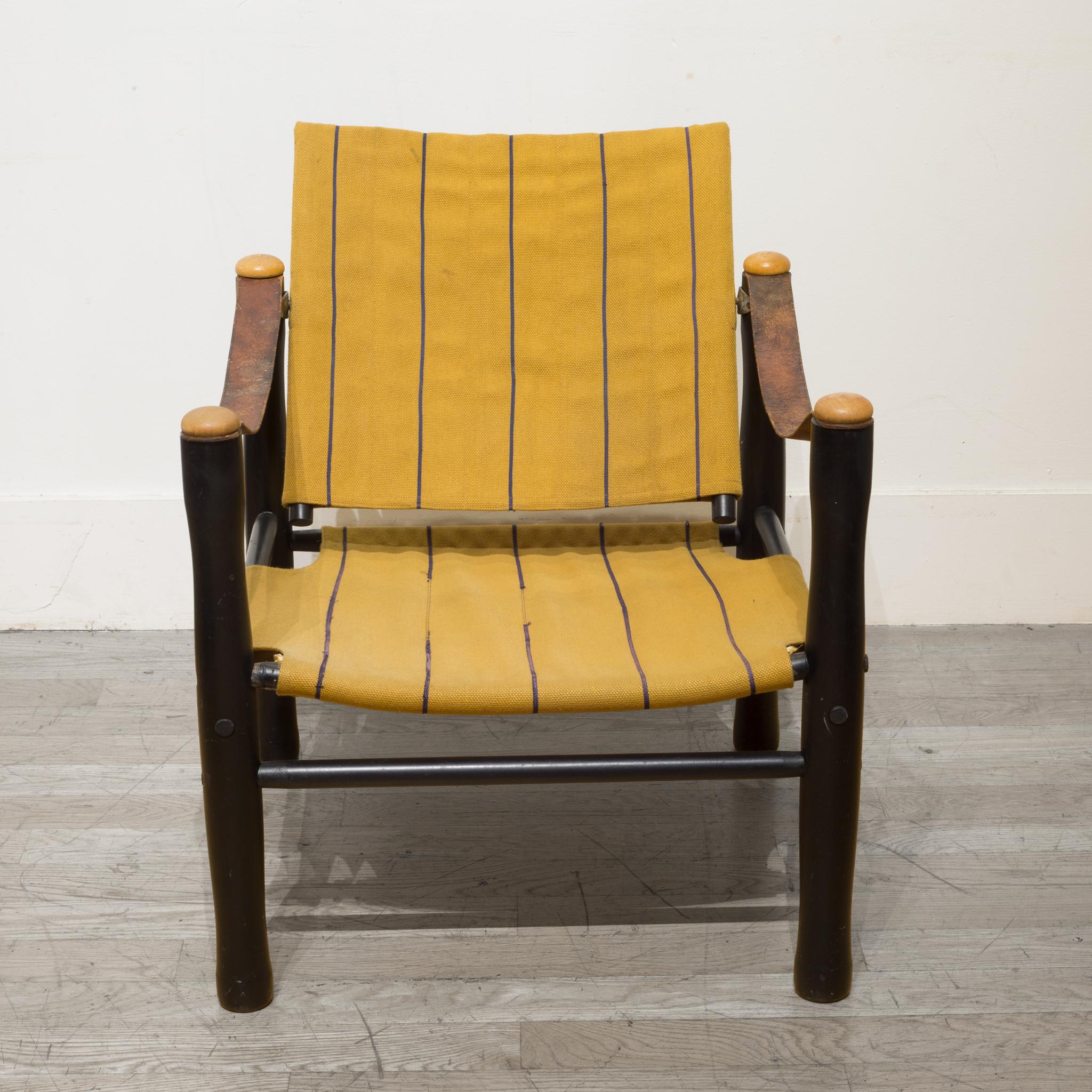 About

This is an original Mid-Century Modern safari armchair with a wooden base, leather straps and original Astrid Sampe fabric. This chair was part of the Trivia line designed to be flat packed and the purchaser would assemble at home. A