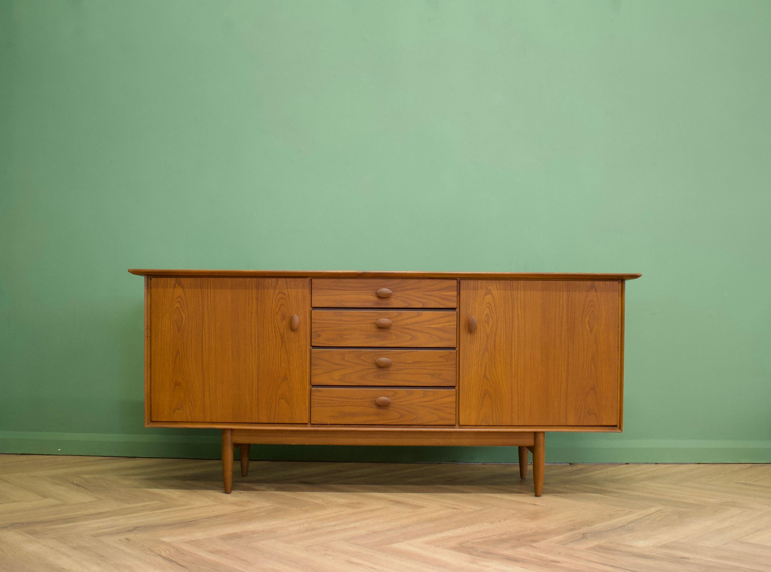 - Mid-Century Modern sideboard.
- Featuring three drawers and two cupboards
- Manufactured in the UK
- By Scandart
- Made from elm and elm veneer.