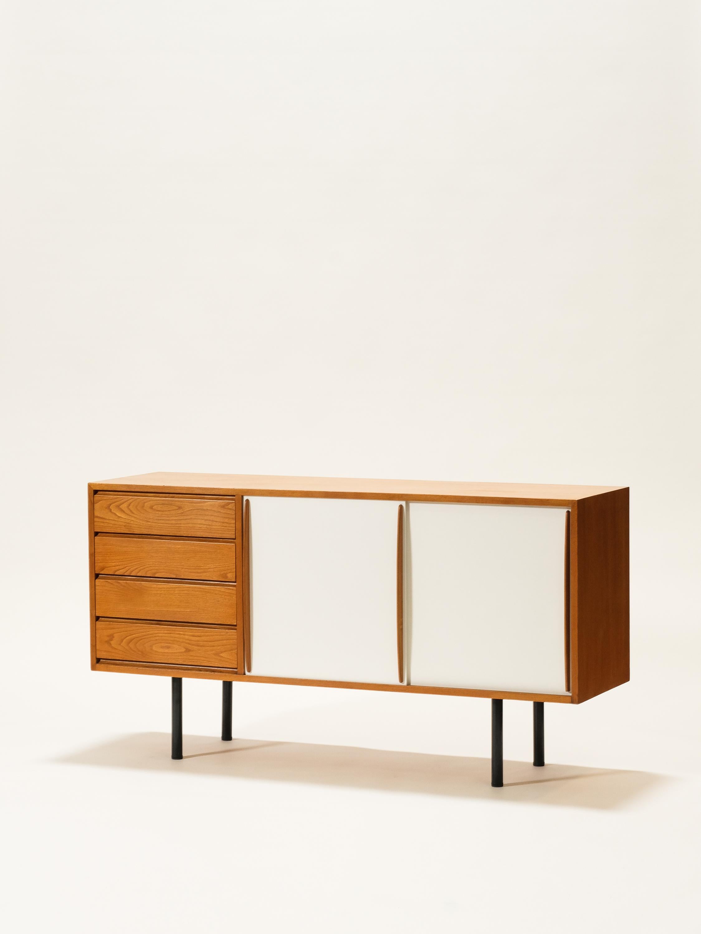 A wonderful sideboard by Finnish designer Olli Borg. Model 4004 for Asko, Finland c. 1950s. A set of 4 drawers, 2 sliding doors and shelving interior, metal legs.

Length 150 cm, depth 43 cm, height 80 cm.

Wear consistent with age and use.
