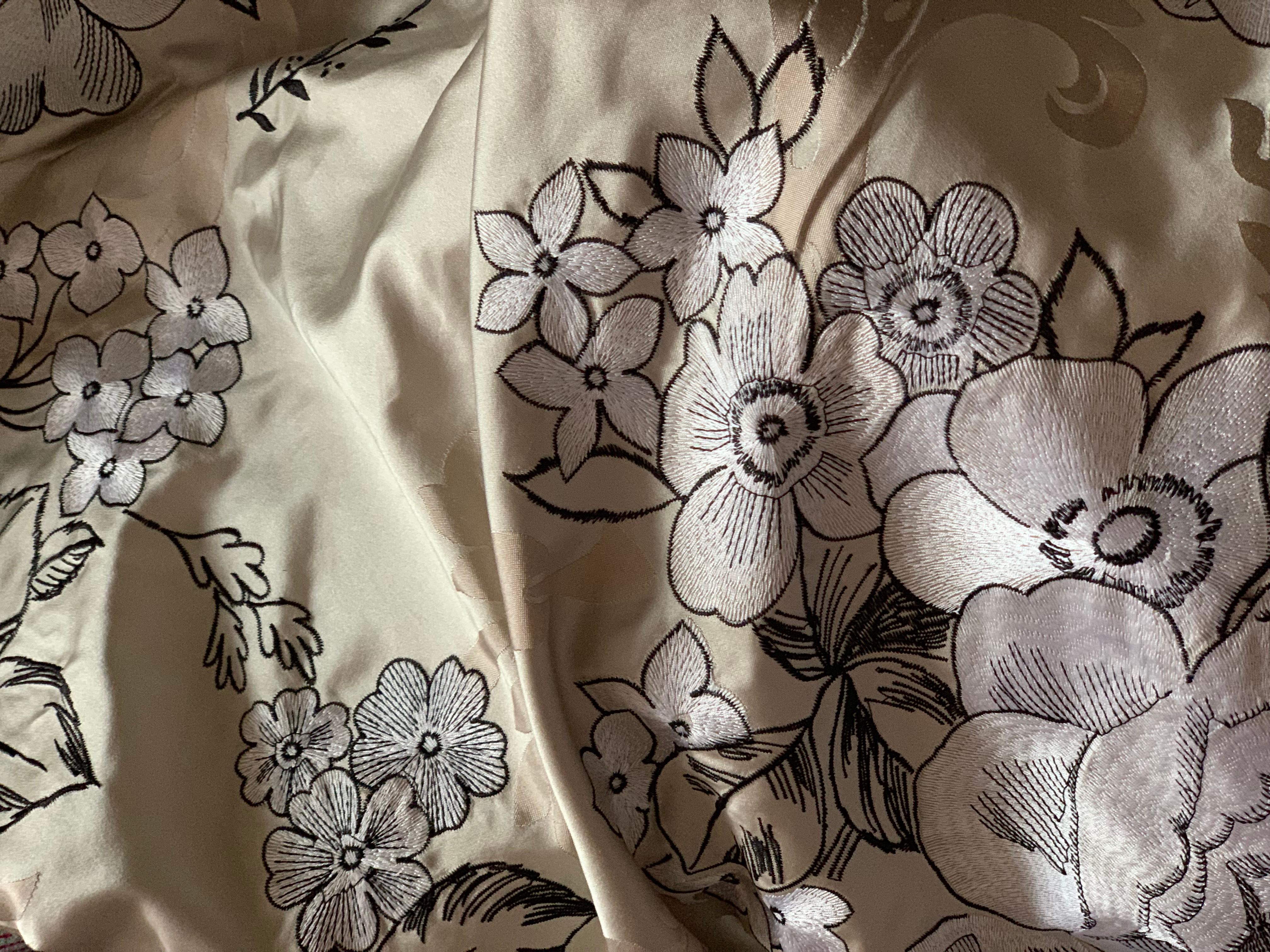 Midcentury embroidered silk fabric, white floral champagne taupe, rare vintage. Gorgeous midcentury textile. Marked 100 percent silk. Approximately 7 yards. About 48” width. Lovely graphic, pop art quality to the traditional floral design and luxury
