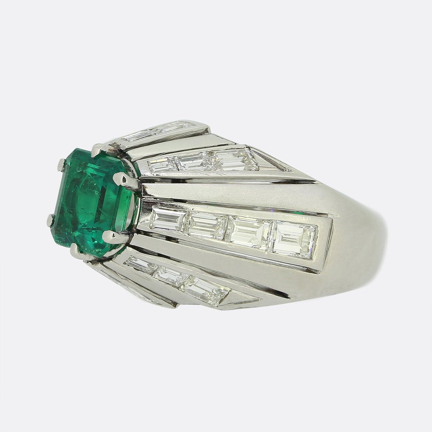 Here we have a superb mid-century ring excellently paying homage to an Art Deco style. This platinum piece sits particularly proud on the finger and plays host to a single square shaped emerald at the front of the face showcasing an luscious