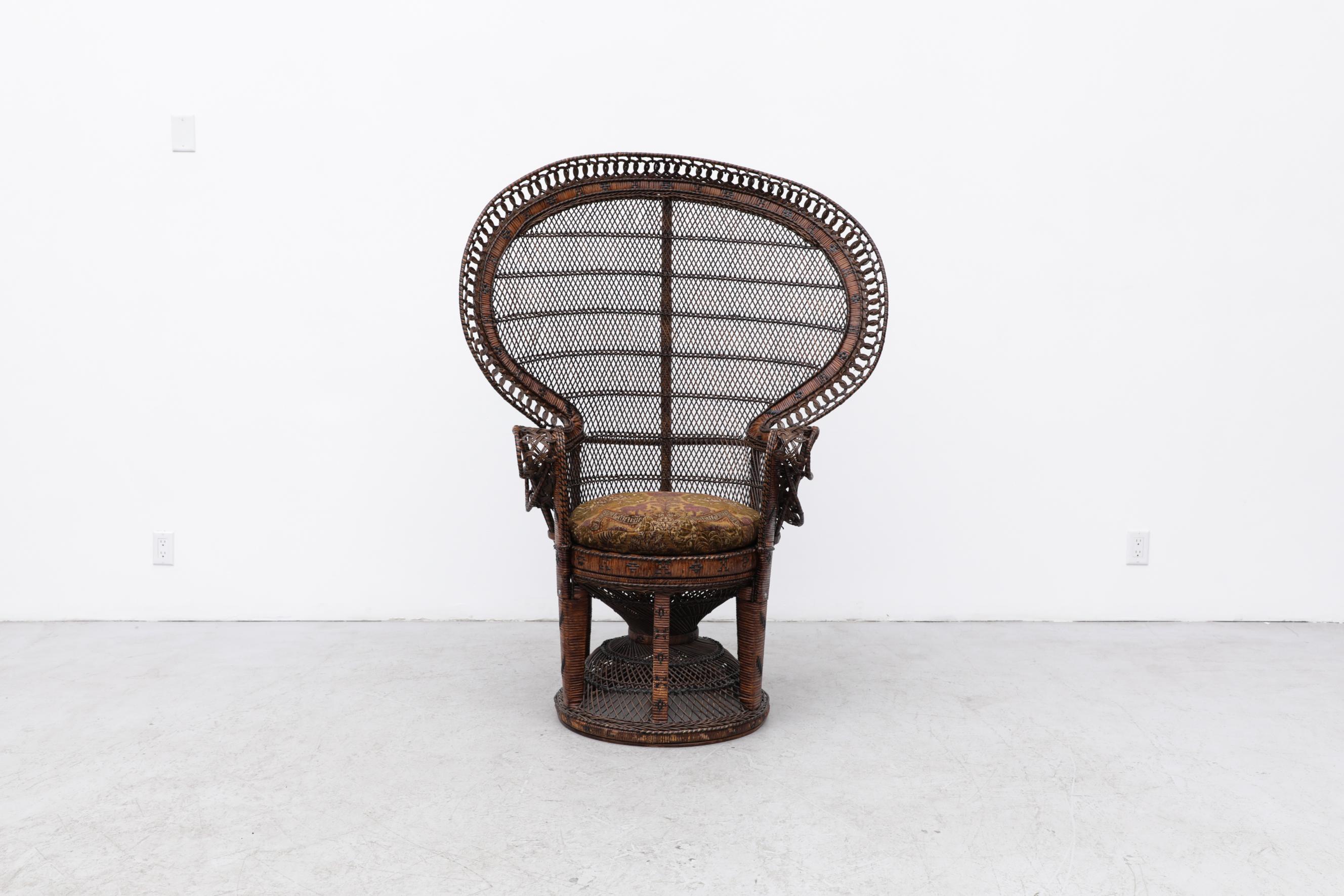 The Iconic Emmanuelle Wicker Peacock Chair. Made famous by Huey P. Newton photographed in the Peacock chair in 1967 and then later by the 1974 French film, Emmanuelle. The chair is in original condition with visible wear, consistent with its age and