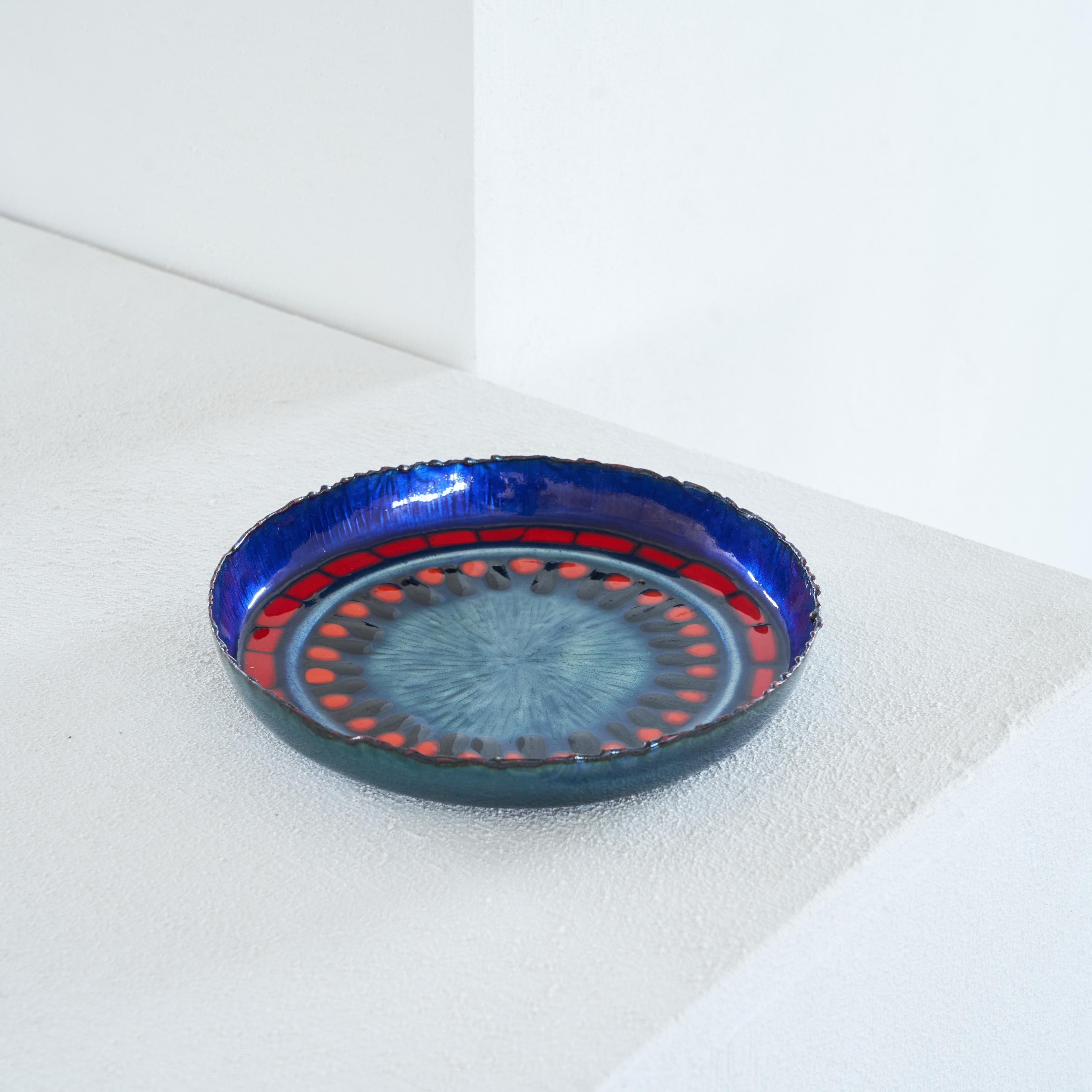 Midcentury Enamel Bowl 1960s.

Beautiful and colorful enameled bowl made in the middle of the 20th century. Great colors and execution. The distinction between the nice and lovely colors and the rough and sharp edges of the upper rim are a nice