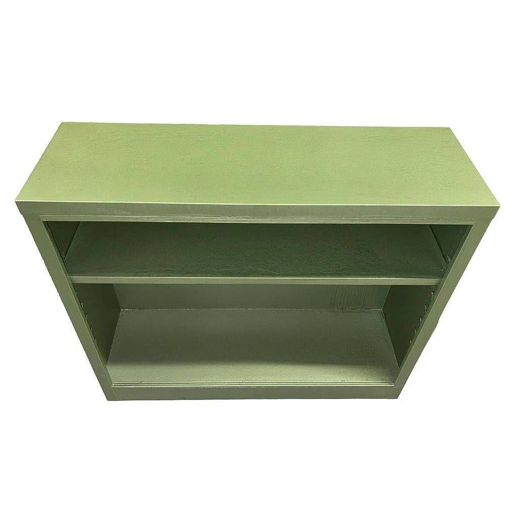 This original Mid-century modern steel bookcase is stylish and functional, perfectly sized for vinyl records. Its vibrant enamel green metal construction adds a pop of color to any room, while its versatile design allows it to be used as a bookcase,