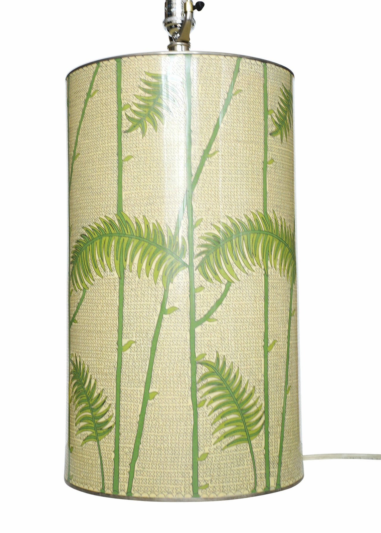 This Mid-century enameled cloisonne´ table lamp features a playful, modern, tropical getaway motif complete with geometric patterns and palm tree branches. The large ten-inch base is one sized from bottom to top and features patterns all
