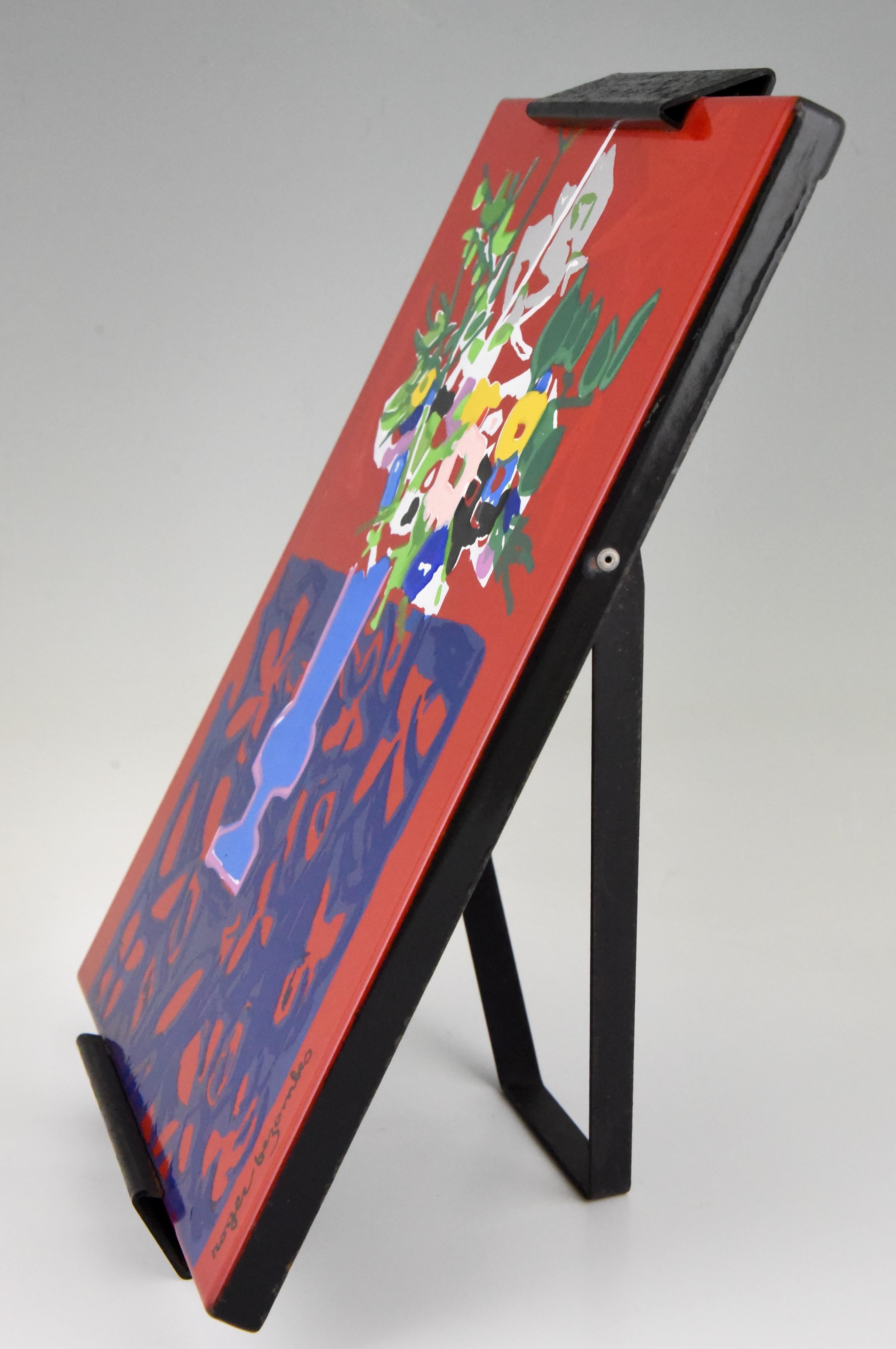 Midcentury painting of flowers in a vase by the French artist Roger Bezombes, 1913-1994, on an enamelled iron plate.
This panel has been executed by J. Neuhaus, Behobie. Numbered 894.
Wall hanging plate with folding easel on the