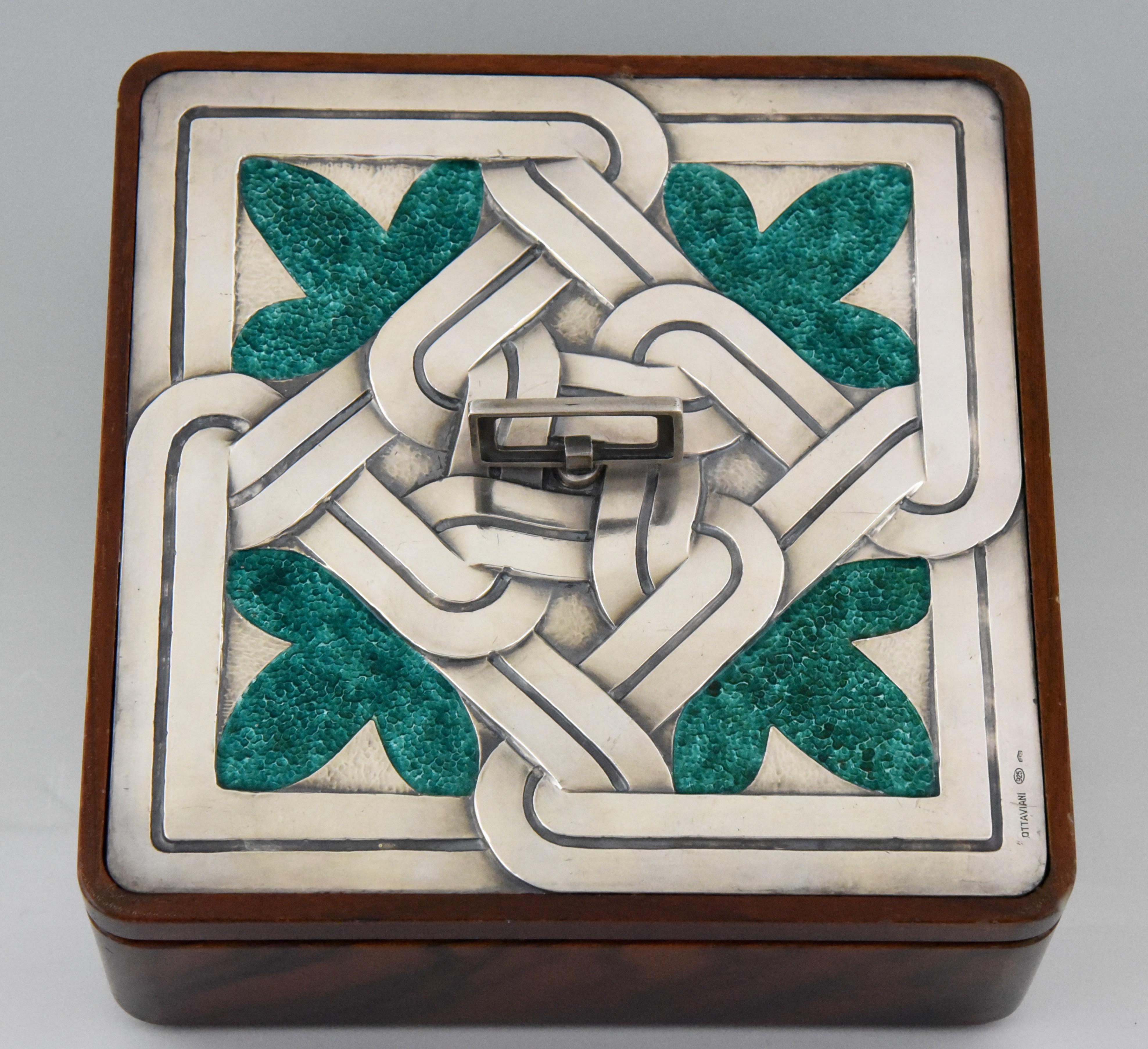 Fine Mid-Century Modern box in enameled Sterling silver and wood by the Italian artist Ottaviani, circa 1960. Signed and with hallmark.
Ottaviani (1945) is a jewelry and silver firm located in the small seaside town of Recanati, Italy. They had a