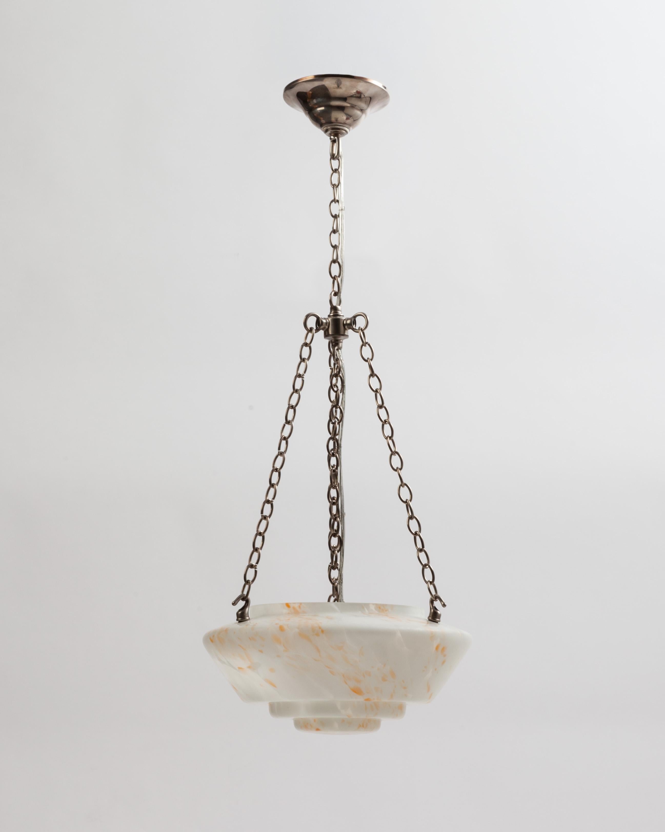 AHL3803
A vintage end-of-day glass chandelier with a step profile and a satin surface on the lens. Suspended with nickel metalwork custom made in the Remains Lighting workshop. Due to the antique nature of this fixture, there may be some nicks or