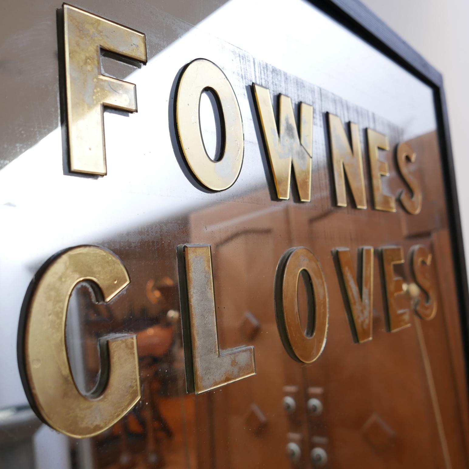 A scarce advertising mirror for 'Fownes Gloves'. 

A company that was established in England in 1777, and still operates in America today. 

England, c1950s, perhaps earlier. 

Reeded wooden frame with later black painting. 

Original mirror