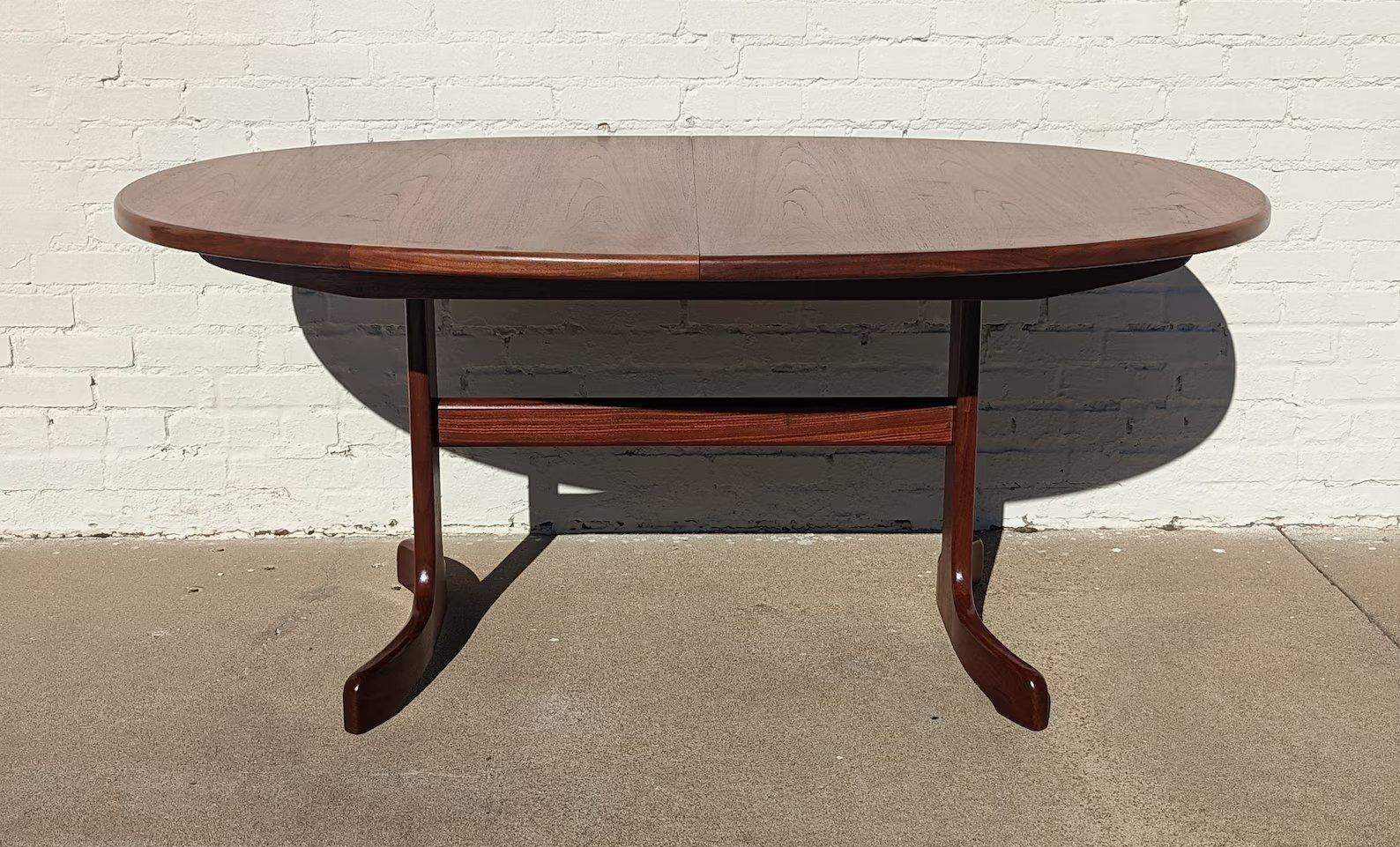 Mid Century English Modern G Plan Teak Dining Table

Above average vintage condition and structurally sound. Has some expected slight finish wear and scratching. Outdoor listing pictures might appear slightly darker or more red than the item does