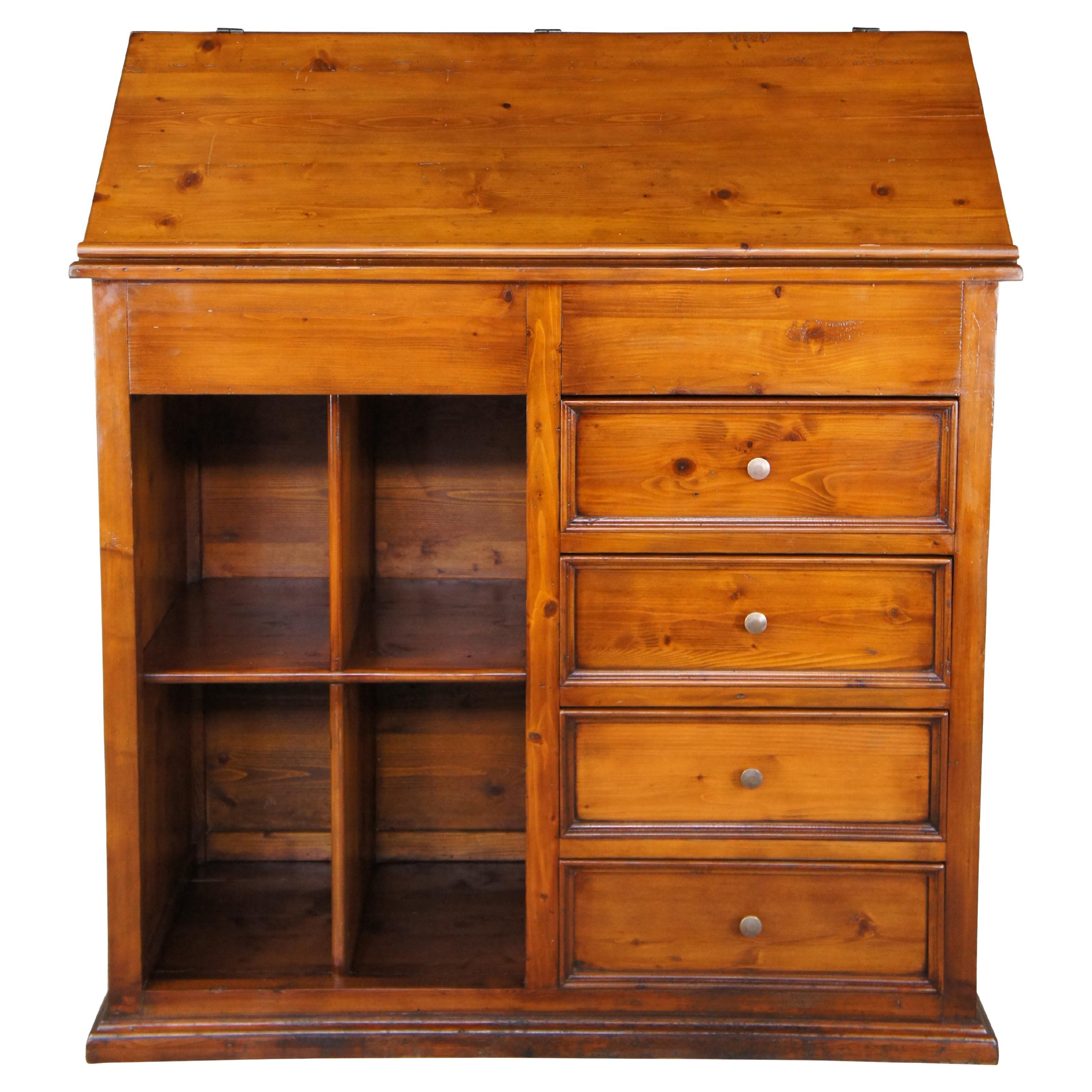 Charming mid 20th century slant top desk, dresser or secretary.  A fun cross between an old standing desk and chifferobe.  Features a large slant top that can be used for work or display.  The lid opens and is held in place via a latch allowing for