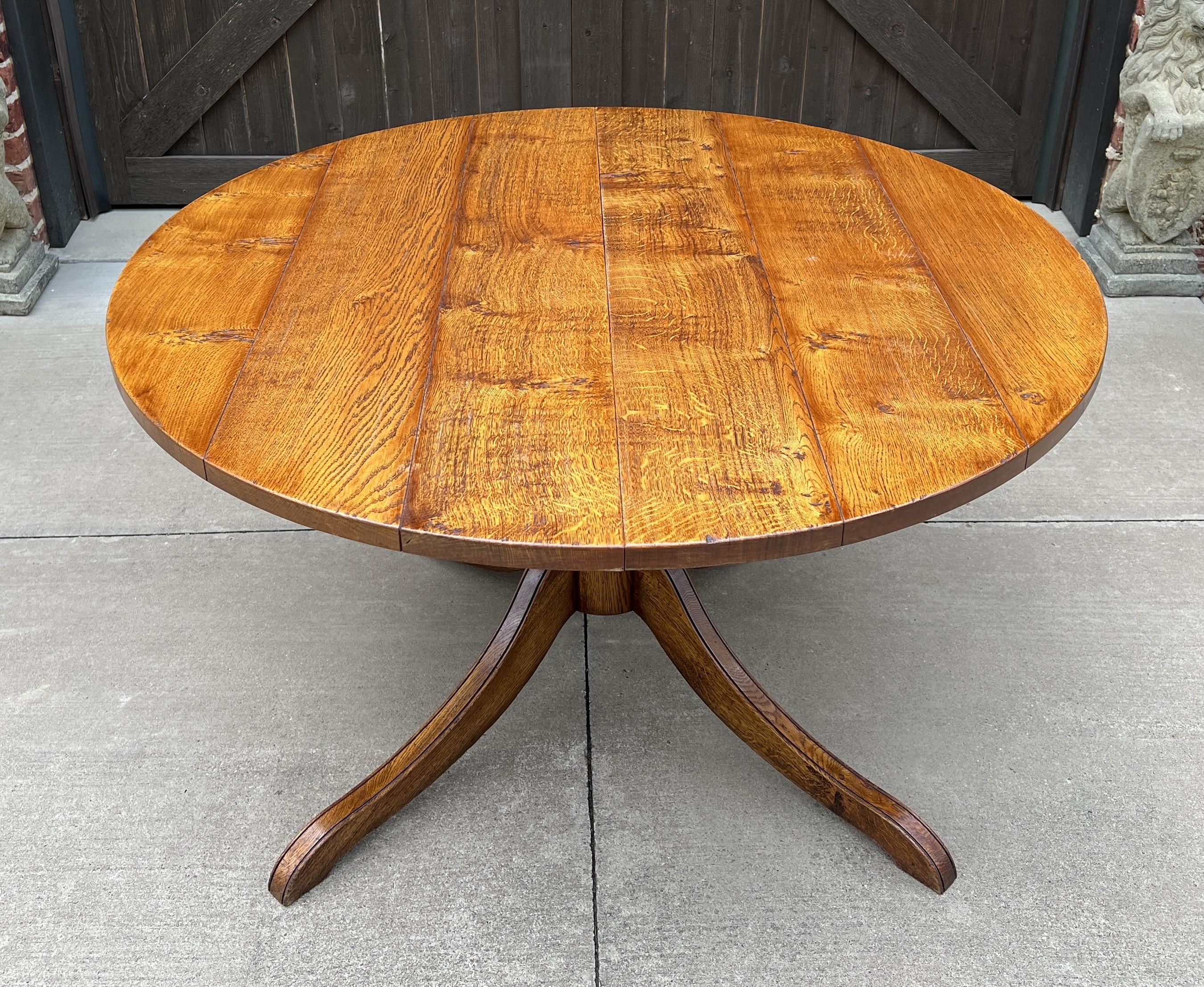 OUTSTANDING Vintage midcentury English Oak dining table or game table with Leaf on Pedestal Base~~ROUND/OVAL~~circa 1940s

 Beautiful oak top with 4-legged pedestal base ~~beautiful rich honey oak patina and full of character!

 Versatile