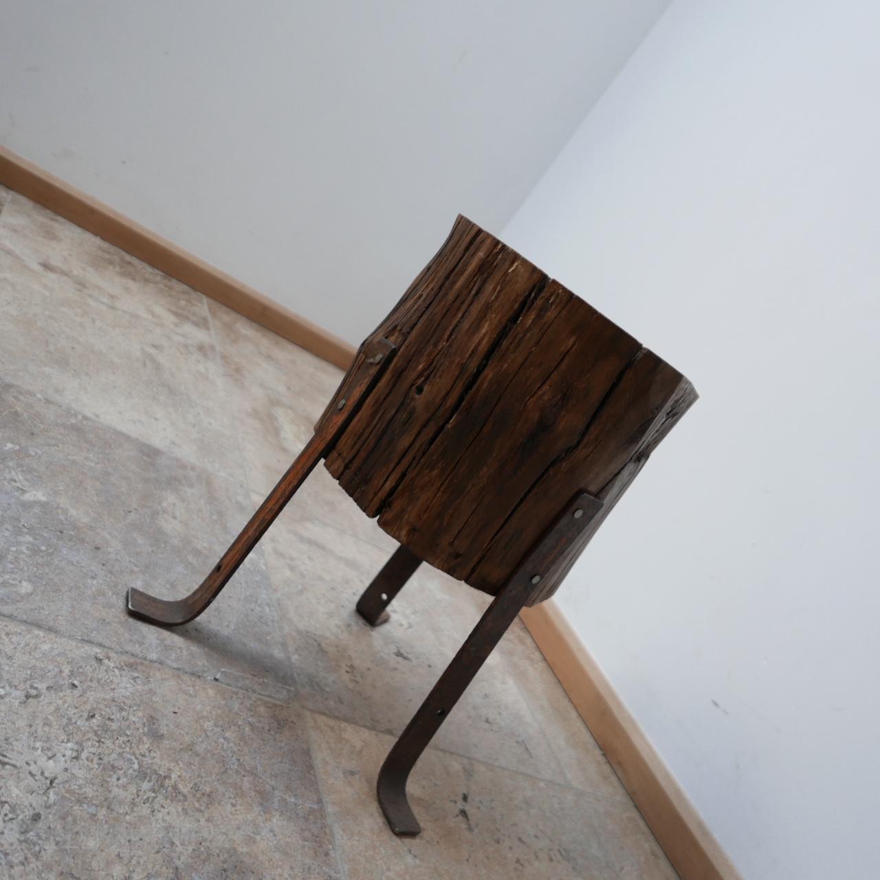 An unusual naively made tree stump side table. 

England, c1970s. 

Iron tripod feet. 

Naively made but good condition. 

Location: London Gallery. 

Dimensions: 33 Diameter x 47 H in cm. The Diameter of the top is 29 cm. 

Delivery: