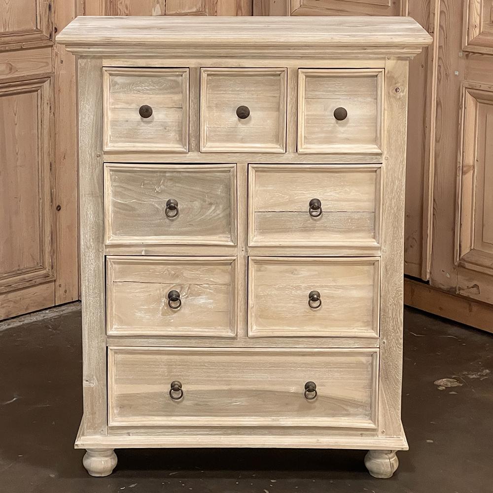 Mid-century English whitewashed chest of drawers makes a great choice for an understated elegant, yet casual decor! Perfect for keeping one's garments organized, there are three small drawer, four medium-sized drawers, and one full width drawer, all