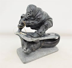 Midcentury Era Akulivik Region Inuit Soapstone Carving of a Man Seal Hunting