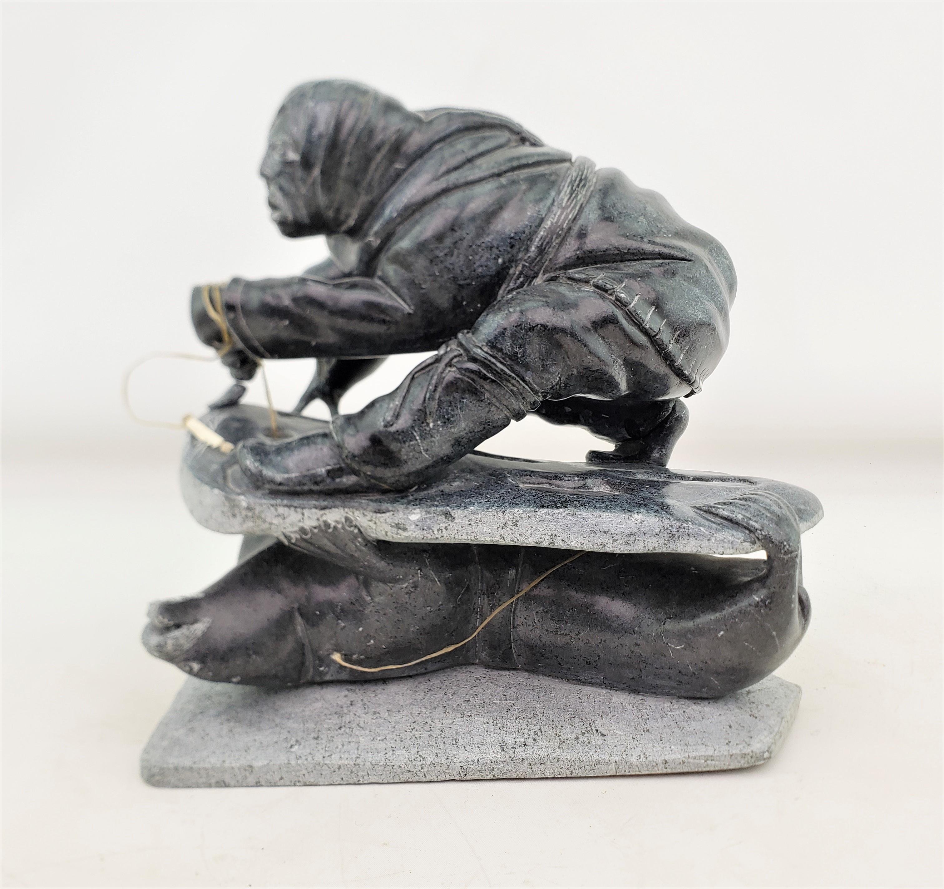 Hand-Carved Midcentury Era Akulivik Region Inuit Soapstone Carving of a Man Seal Hunting For Sale