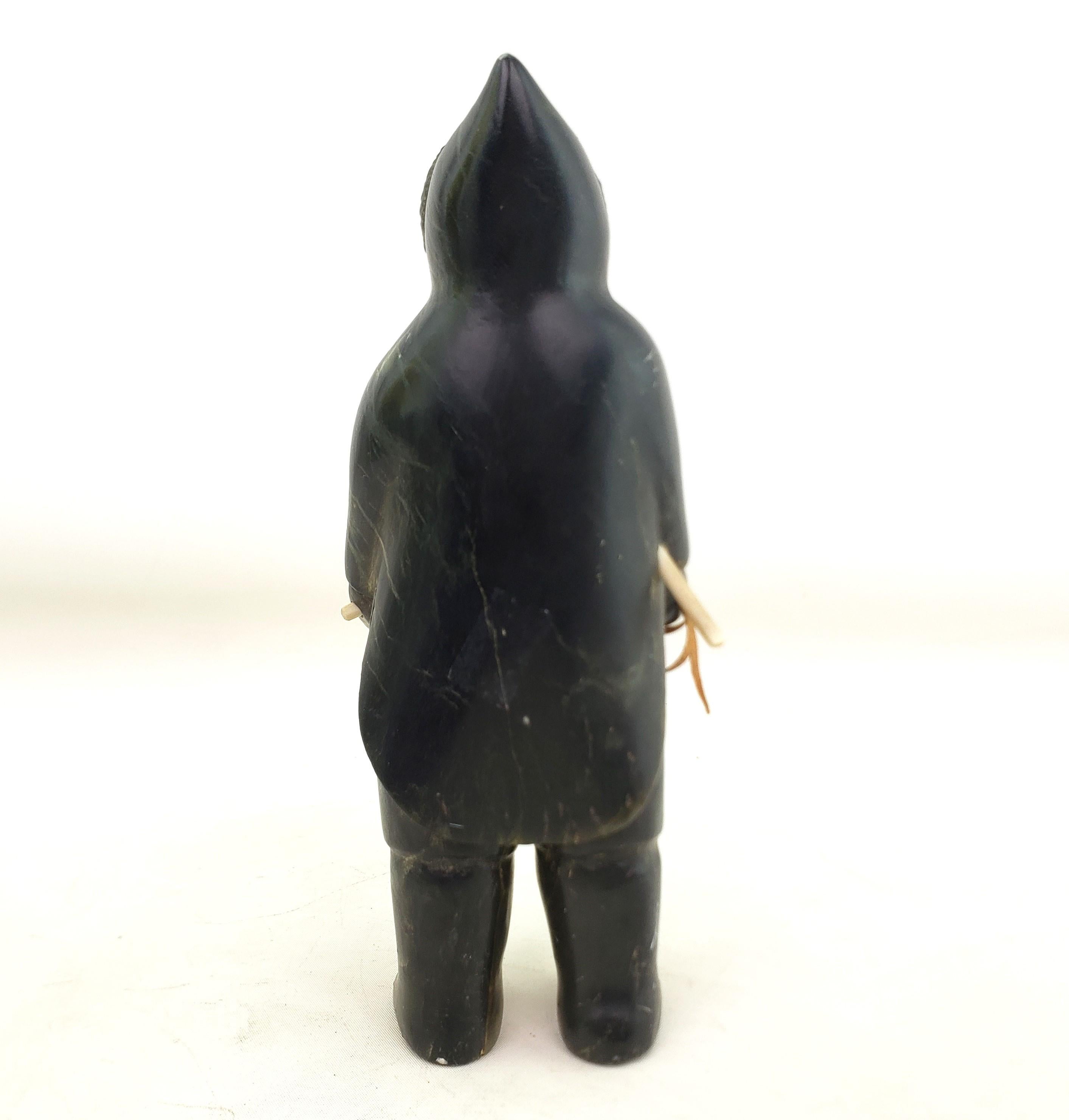 Hand-Carved Mid-Century Era Inuit Soapstone Carving of a Standing Hunter For Sale