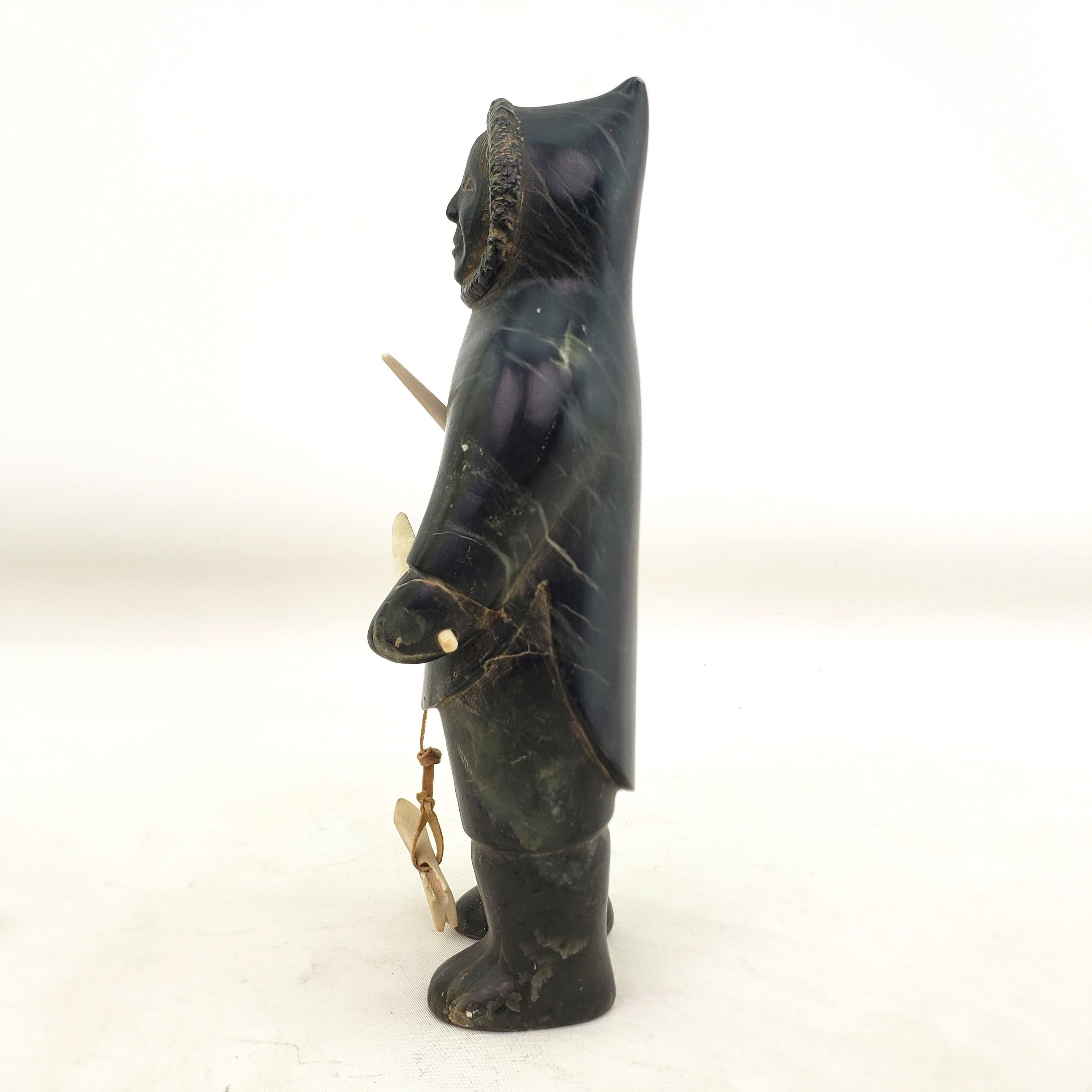 Mid-Century Era Inuit Soapstone Carving of a Standing Hunter In Good Condition For Sale In Hamilton, Ontario