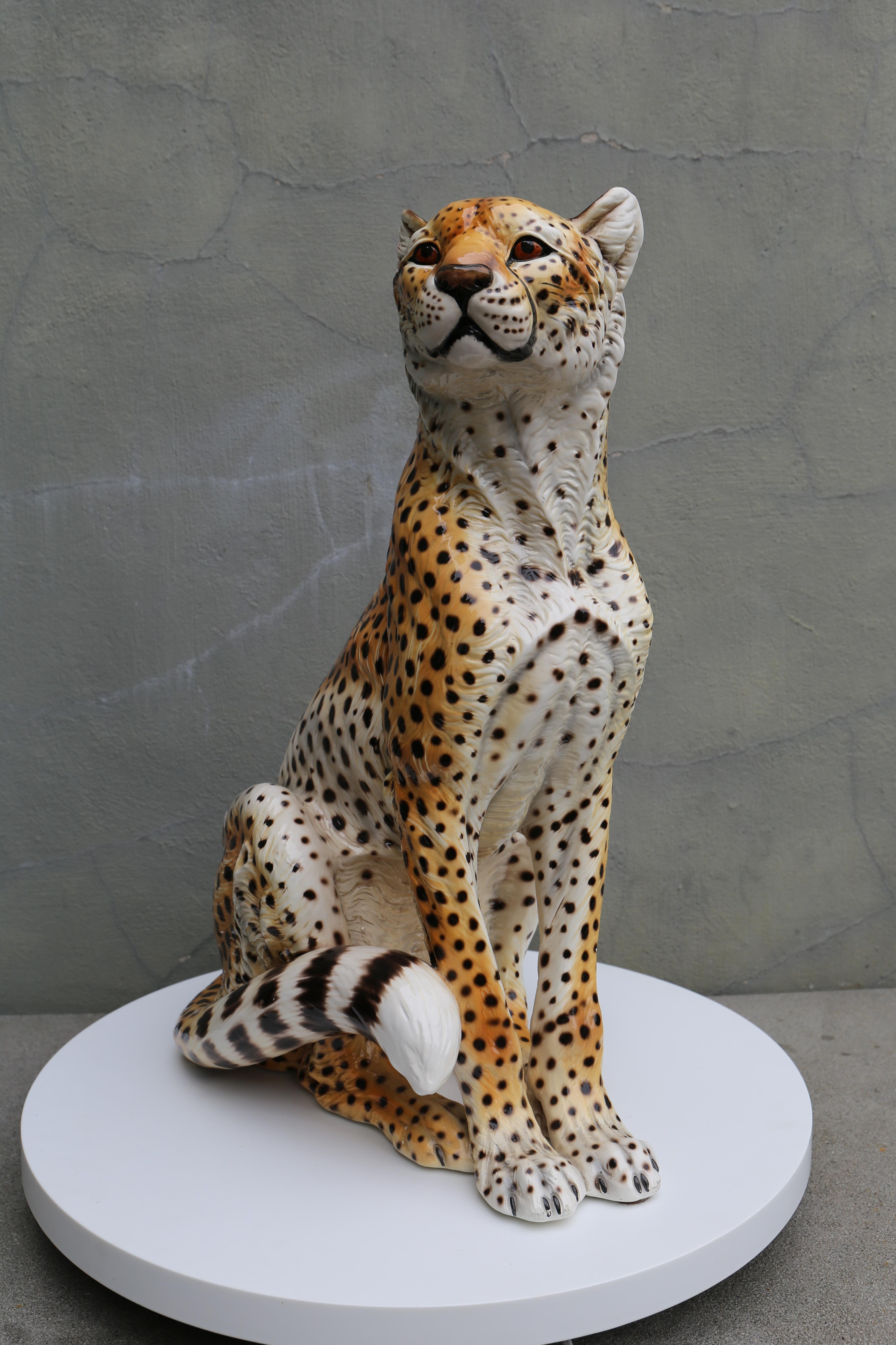 This sizable ceramic and well executed Cheetah sculpture is signed by the maker Ronzan of Italy and dates to approximately 1960 and done in the period Mid-Century Modern style. The sculpture is done in a detailed molded ceramic which has been