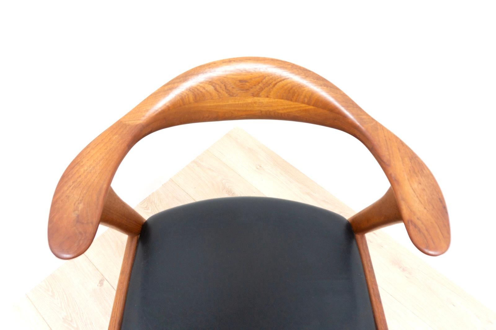 Stylish midcentury Danish Vintage Teak Desk Chair Model 49 by Danish Designer Erik Kirksgaard circa 1959. The cabinetry skill throughout is exceptional as one would expect with a solid teak frame with exceptional grain.

The seat is upholstered in