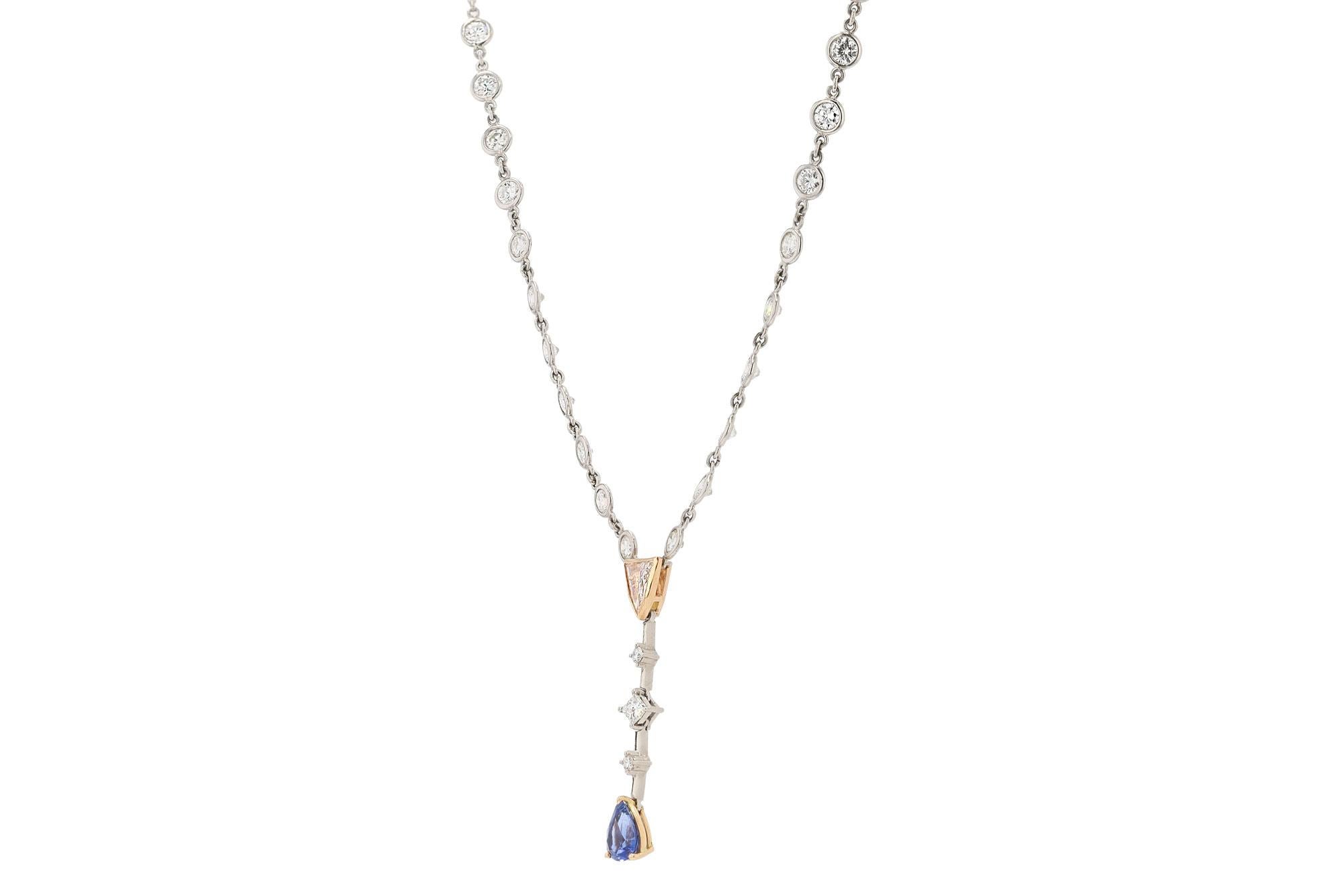 A most interesting Mid Century modern diamond and sapphire drop necklace; part diamonds by the yard, part V necklace. Subtle enough to wear everyday yet dramatic enough to wear on the red carpet. This Hollywood glam stunner is set with 5 carats of