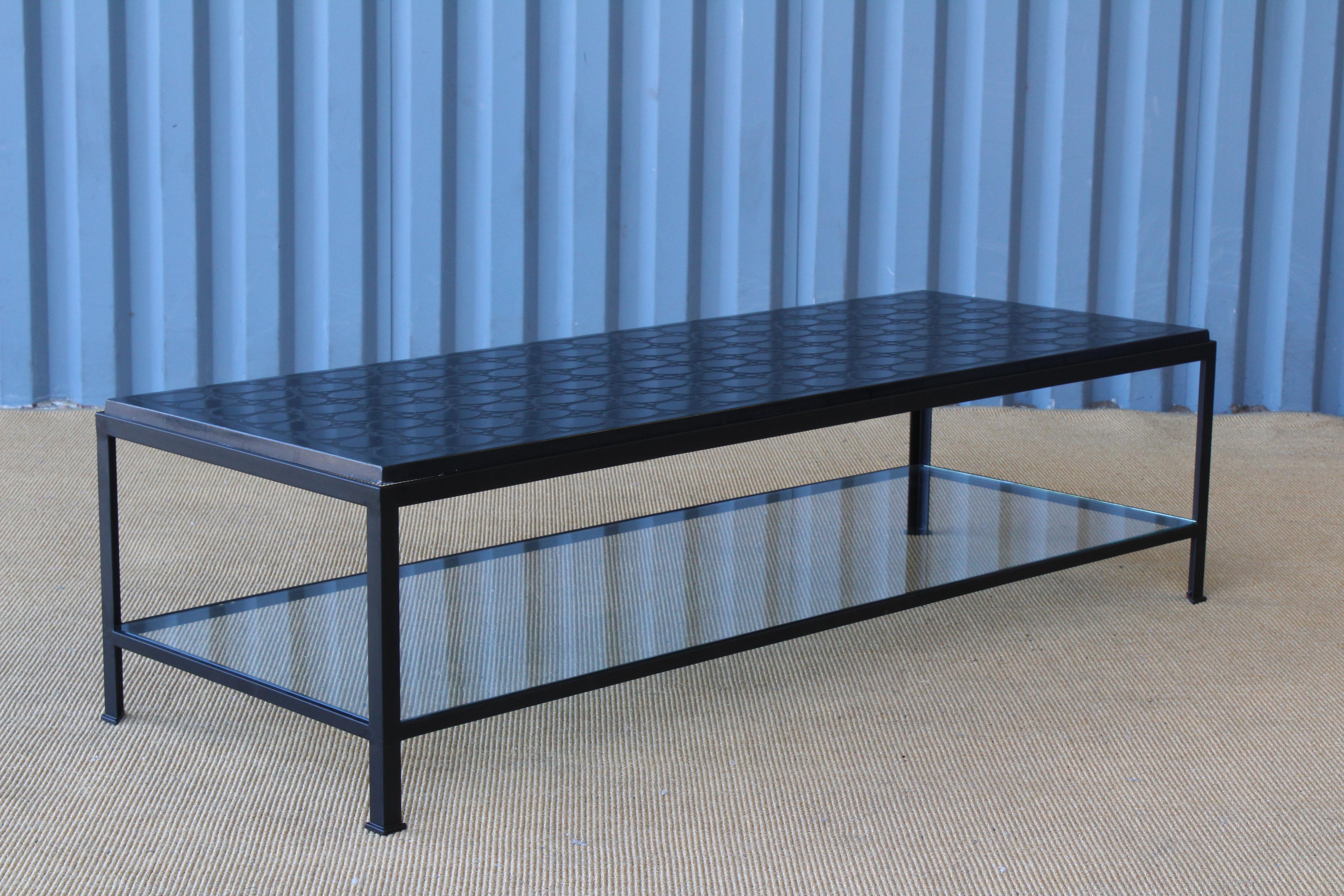 Vintage etched stone slab from France, 1950s recreated into a custom made steel base coffee table. Base is new, made to fit and recently professionally powder-coated in black. Includes a tempered glass bottom shelf. Stone surface is vintage and is