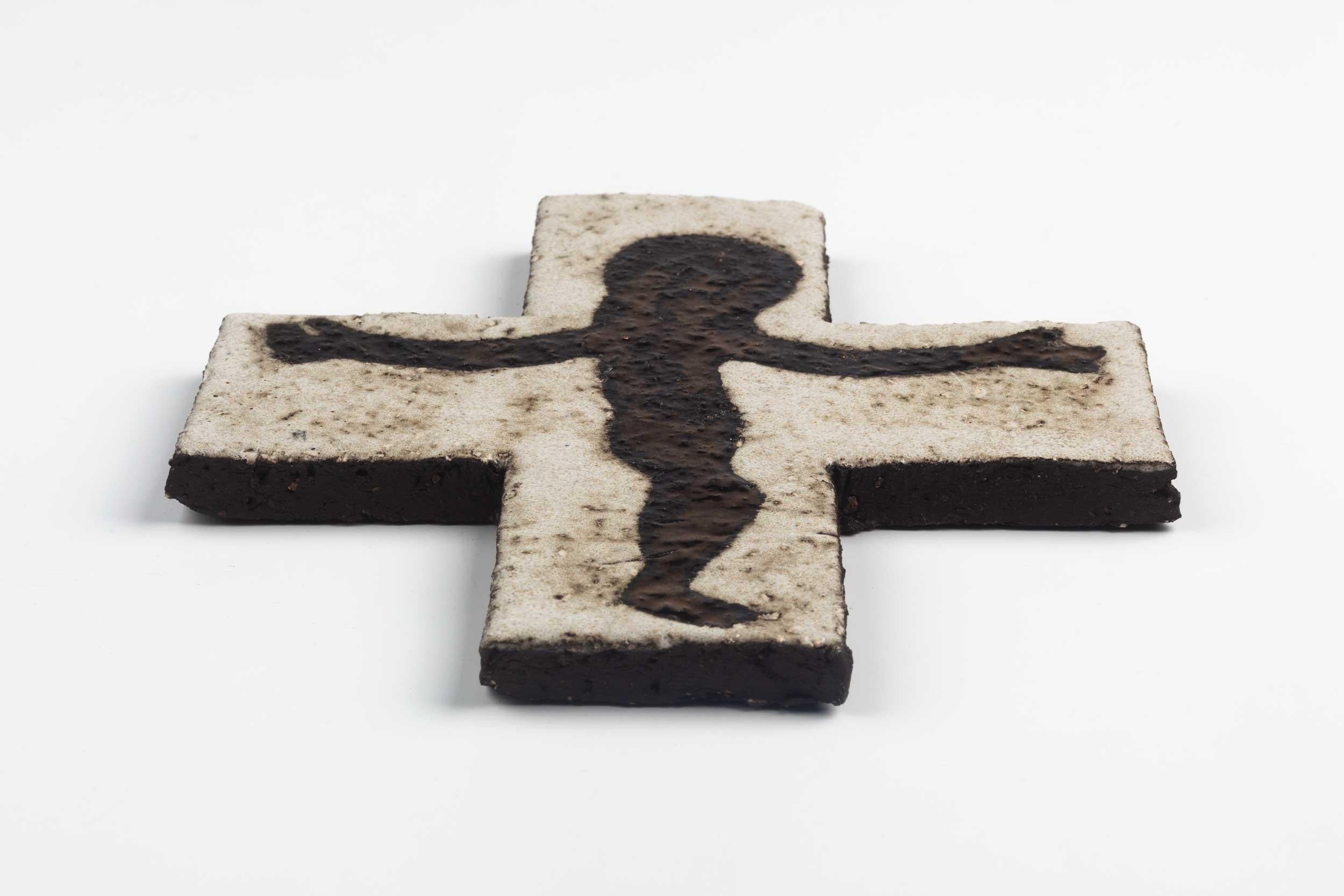 Midcentury European wall cross hand painted in white, and gold flecked black. Shimmering with an otherworldly Christ figure. From a large collection of vintage crosses handmade by Flemish artisans.

From modernism to brutalism, the crosses in our