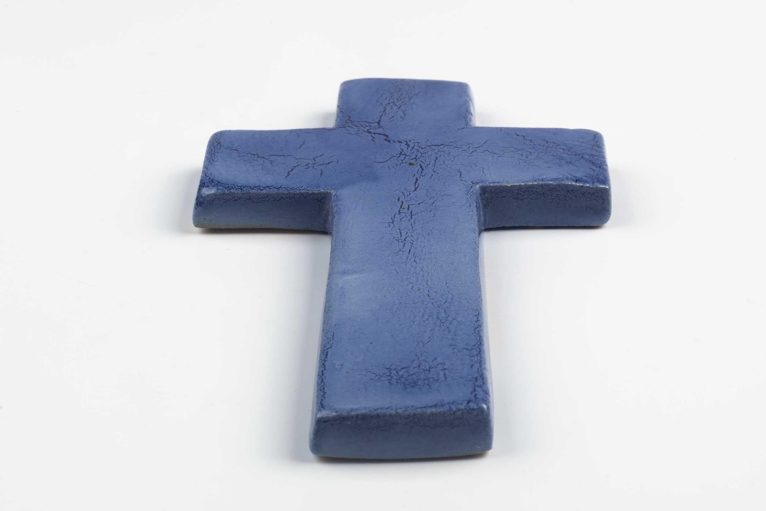 Midcentury European ceramic wall cross in lavender with crackle effect glaze. From a large collection of vintage crosses handmade by Flemish artisans. 

From modernism to brutalism, the crosses in our collection range from being as futurist as a