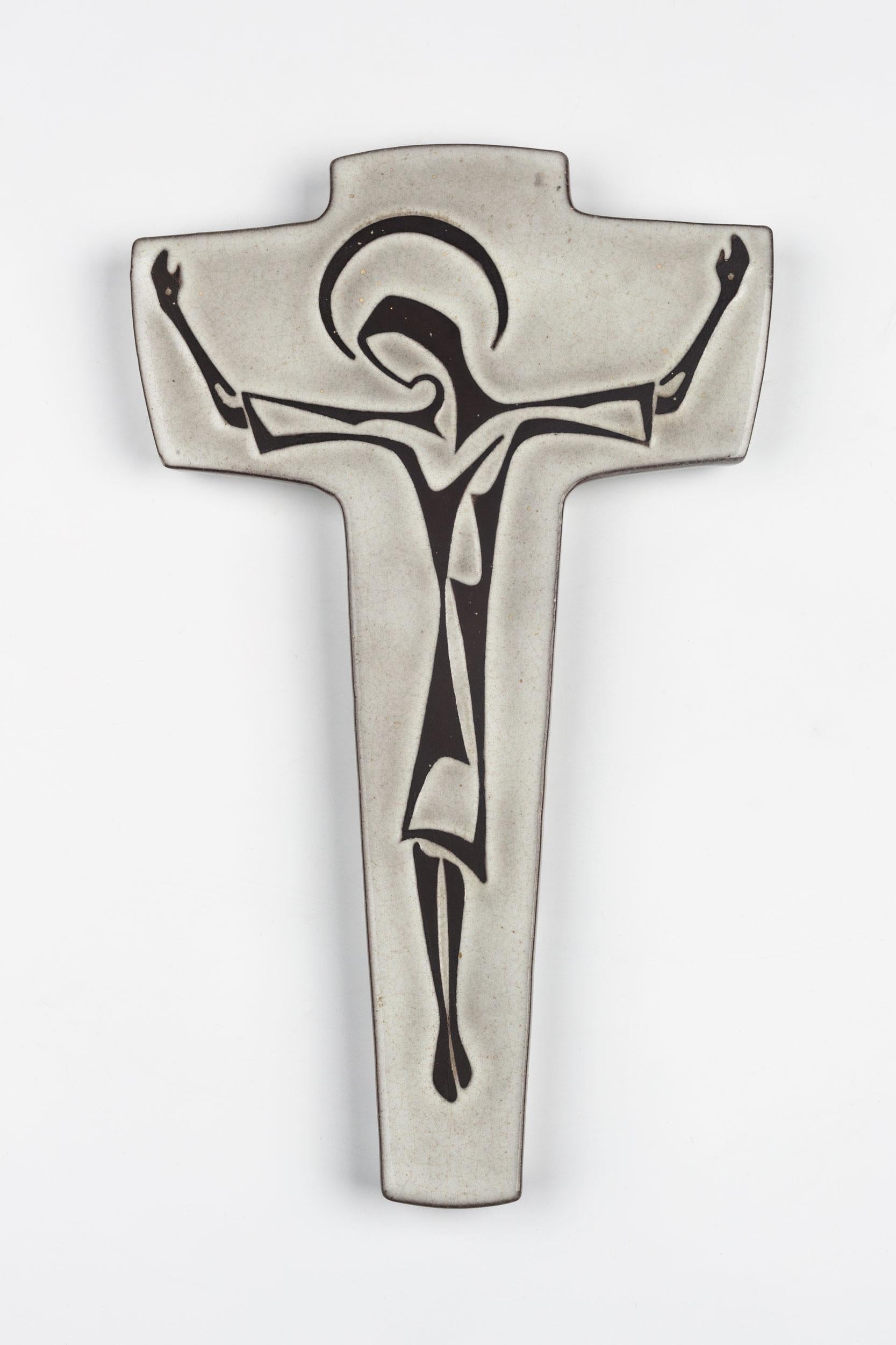 Mid-Century Modern, European crucifix in gray semi-glazed ceramic with christ figure drawing in dark brown. Handmade made in Belgium in the 1980s. 

This piece is part of a large ceramic crucifix collection, all made in Belgium between the 1950