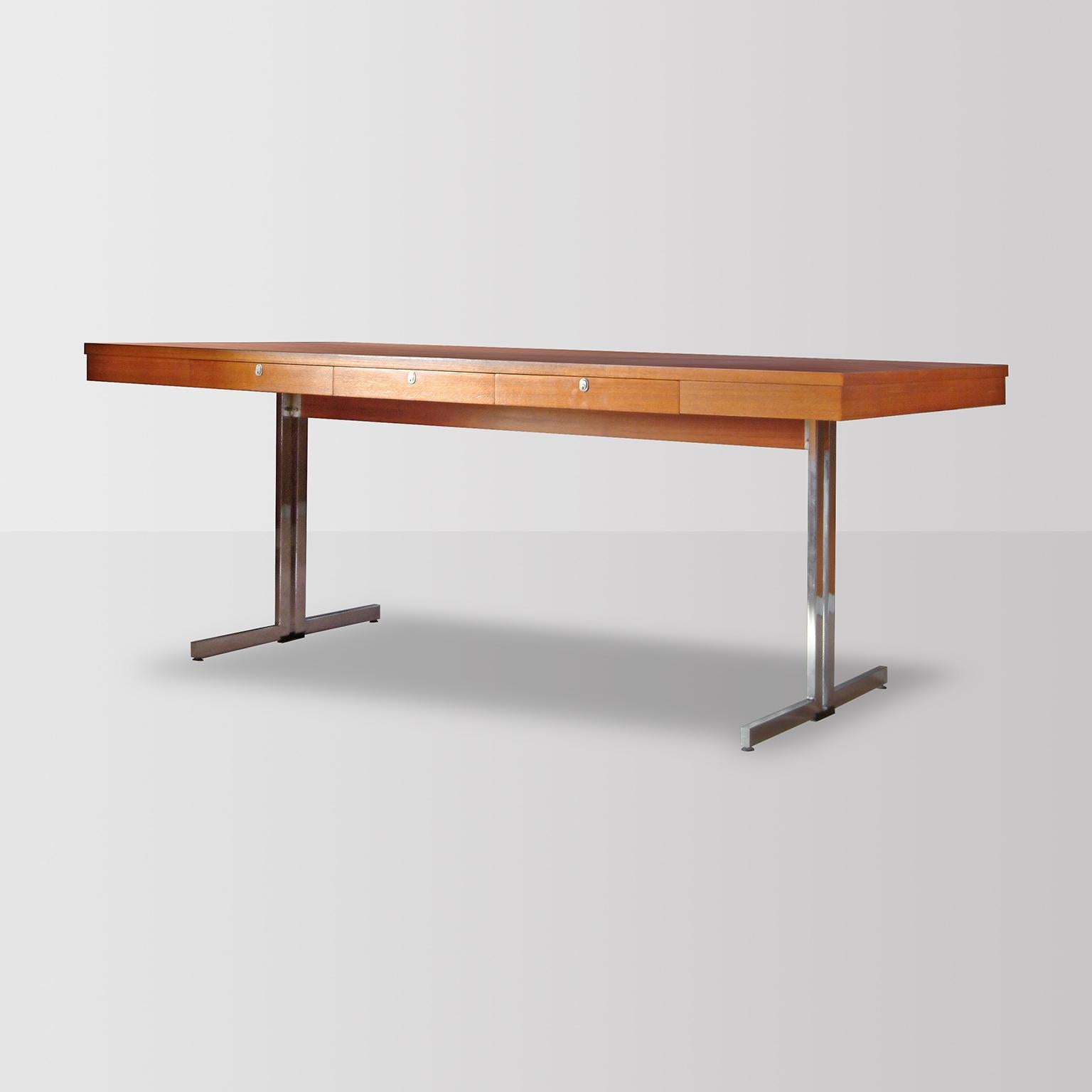 Mid-Century Executive Desk in walnut veneered wood and chrome plated metal. From the 