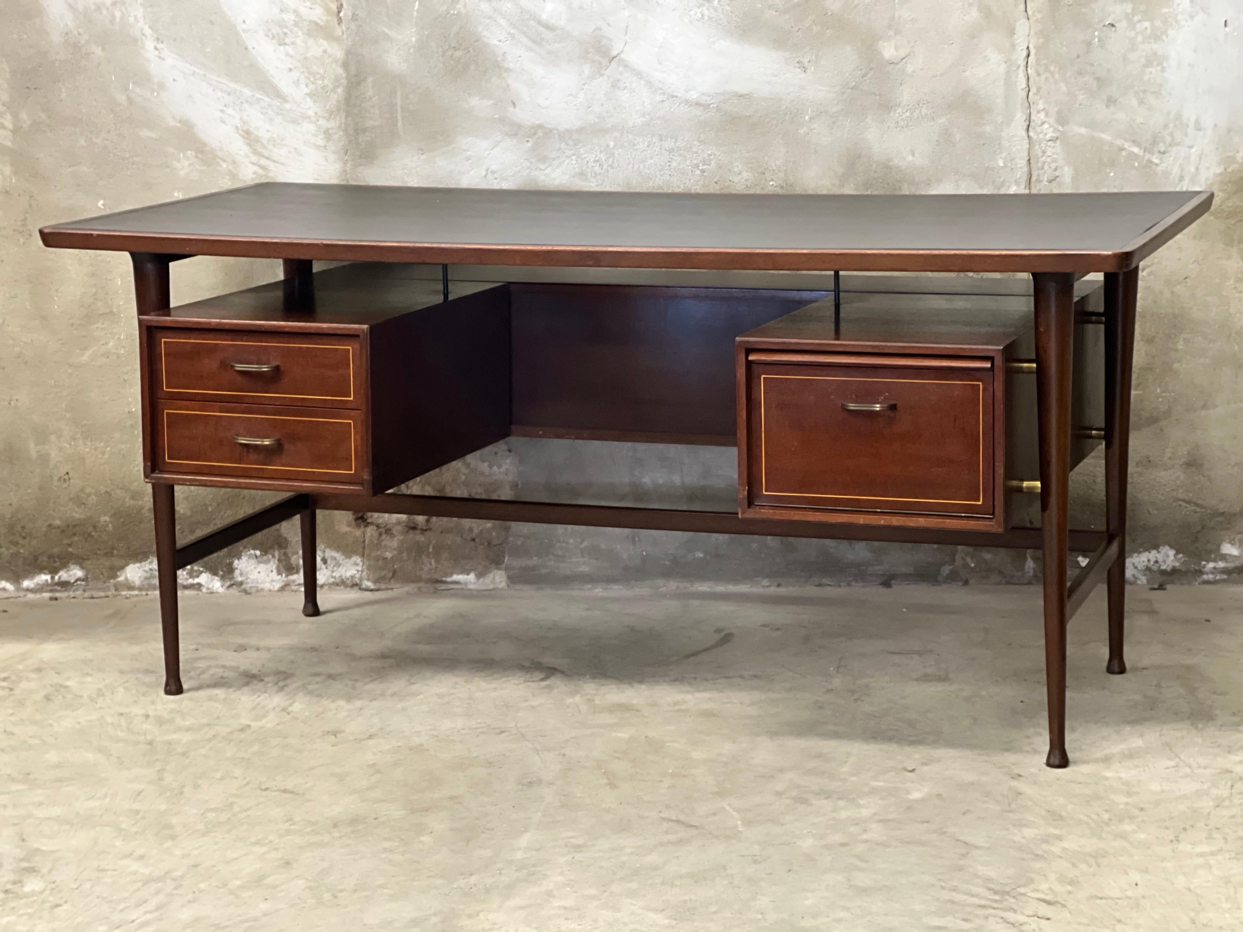 A rarity, this mid-century executive desk, Danish design with leather top inlay. Purchased once at the renowned Greeve furniture furnishings from Hilversum/Bussum. A furniture store that was known for high-end furniture in Art Deco, Amsterdam School