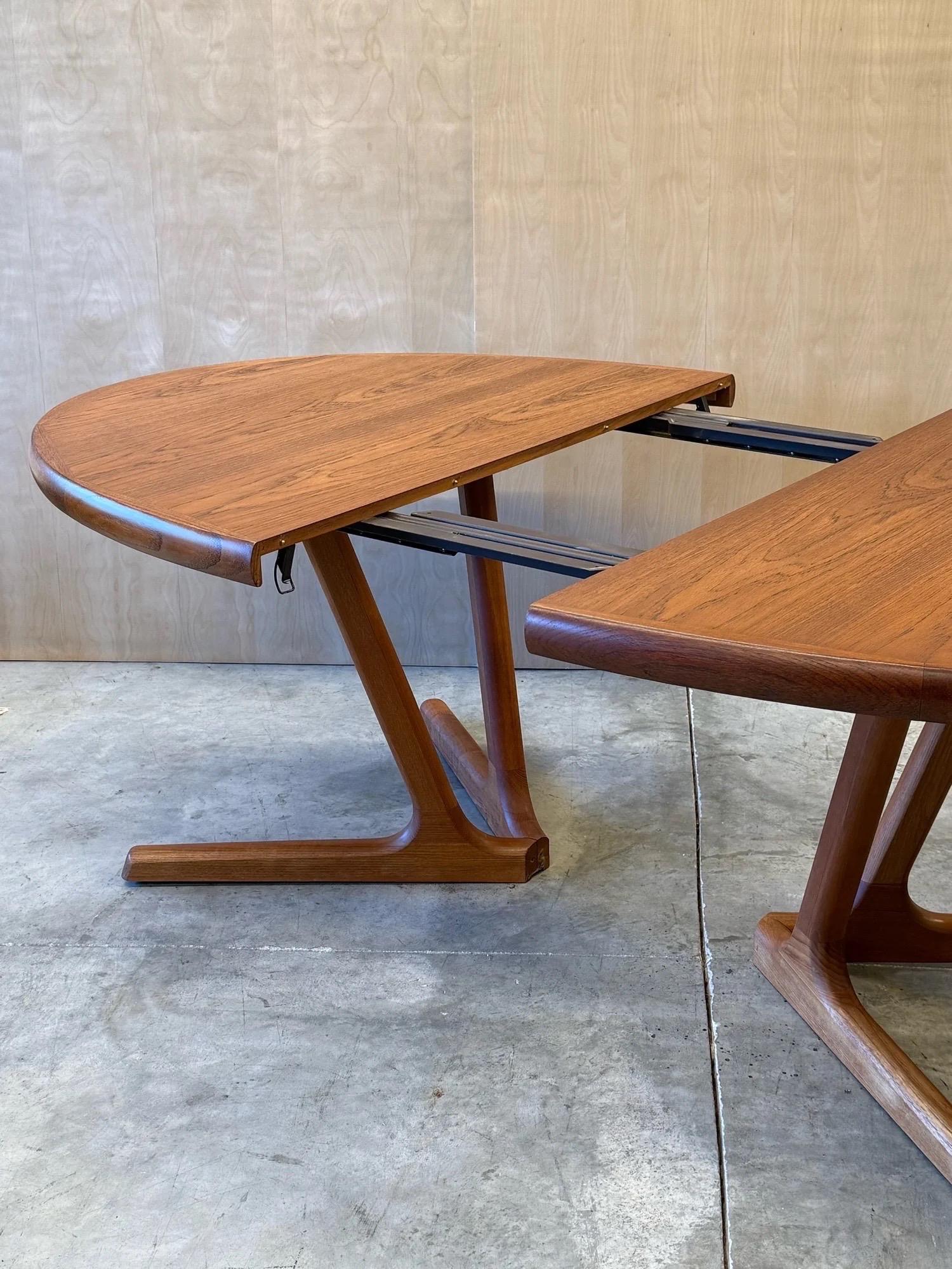 Mid-century expanding dining table designed by Interform Collection, made in Denmark, and an absolute stunner. This dining table is made from teak wood and features gorgeous wood grain atop the table and a geometric border that adds further visual