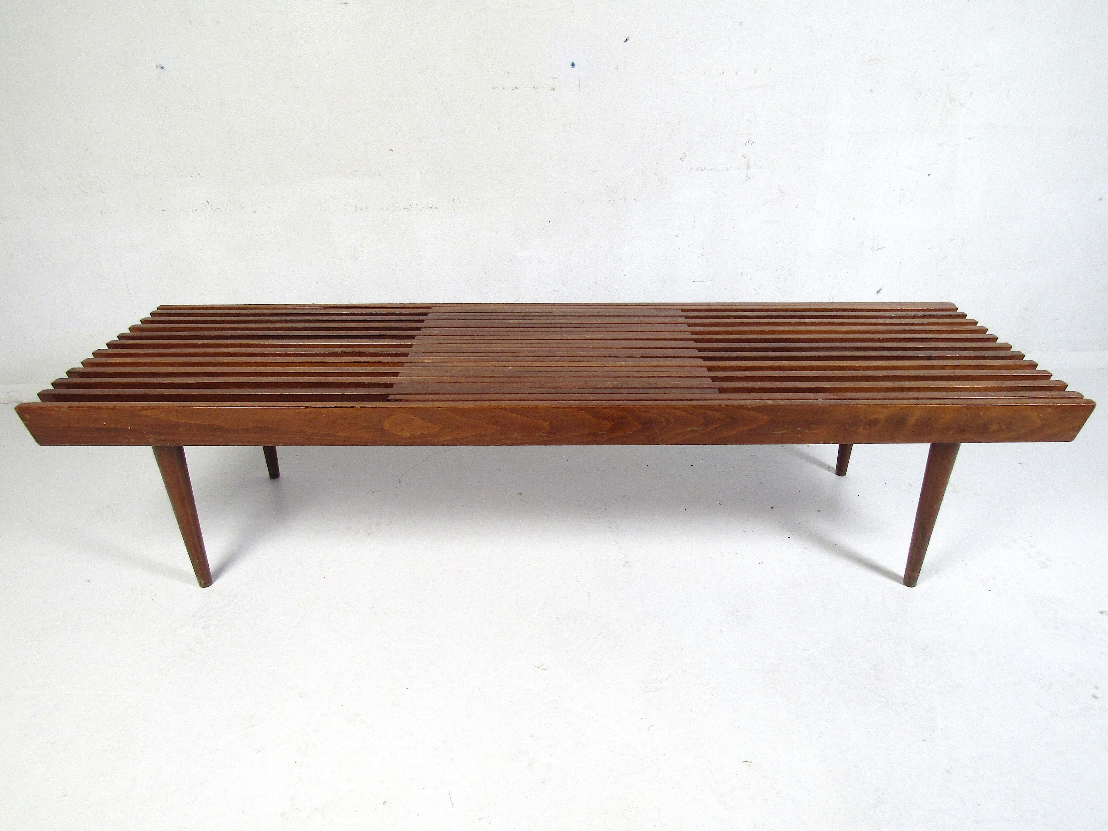 Mid-Century Modern expanding wood-slat bench. Manufactured in the former Republic of Yugoslavia. Sure to make an interesting addition to any modern interior. The table expands from 60 inches wide to 72. Please confirm item location with dealer (NJ